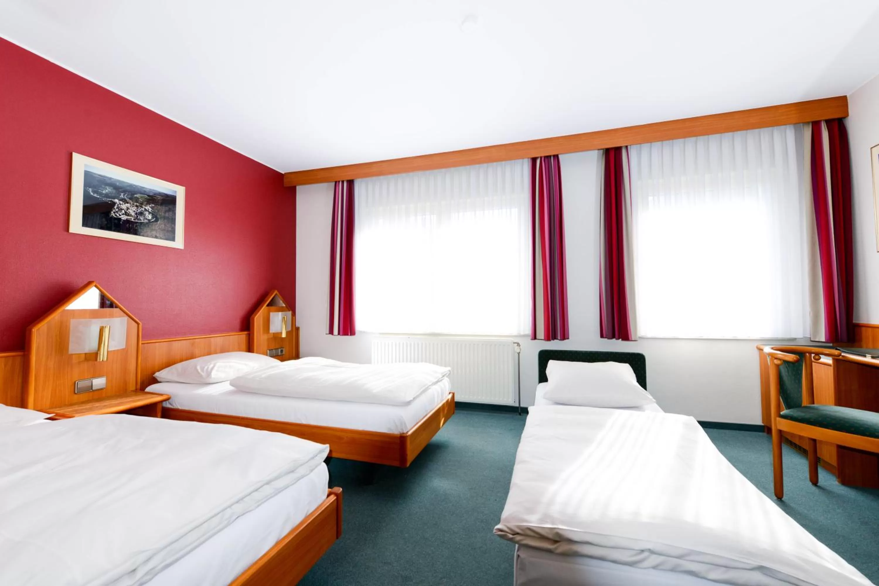 Bed in Hotel Christophe Colomb