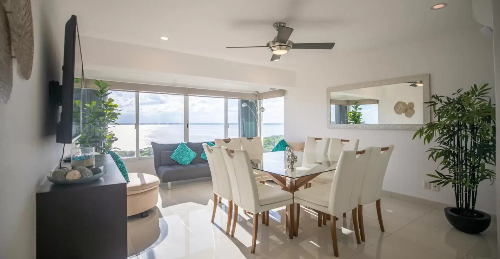 TV and multimedia, Dining Area in Beachfront Penthouses by LivIN Cancun