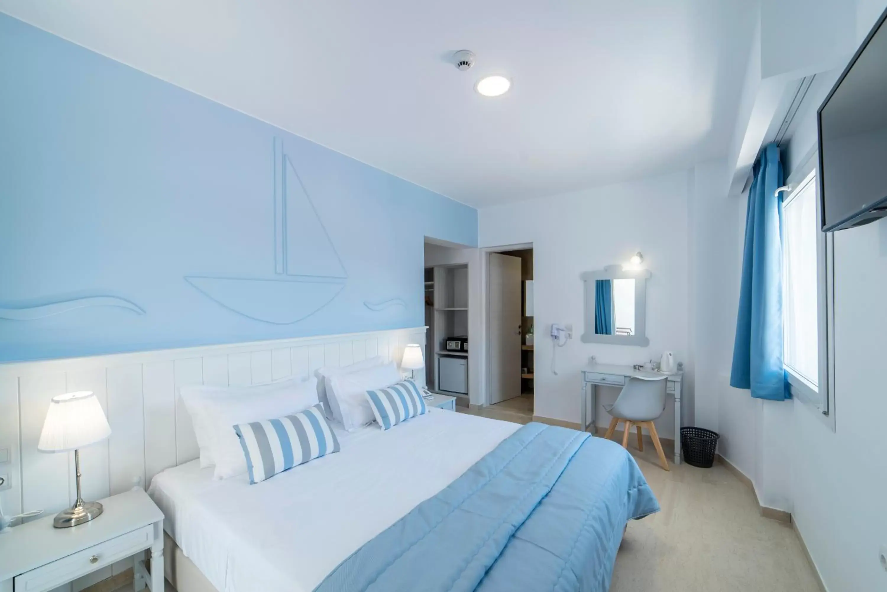 Bed in Naiades Marina Hotel