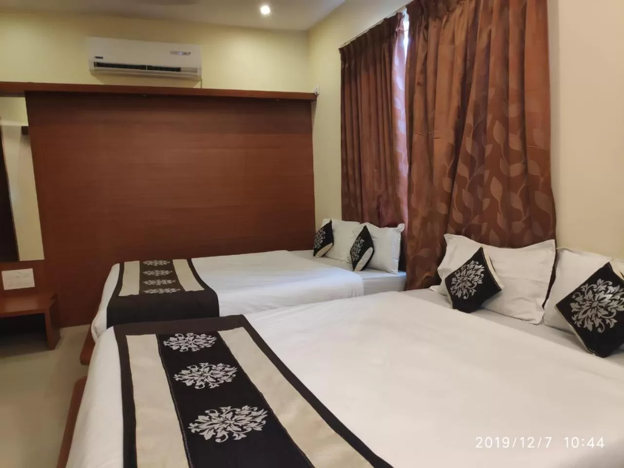 Bed in The Grand Inn Mysore