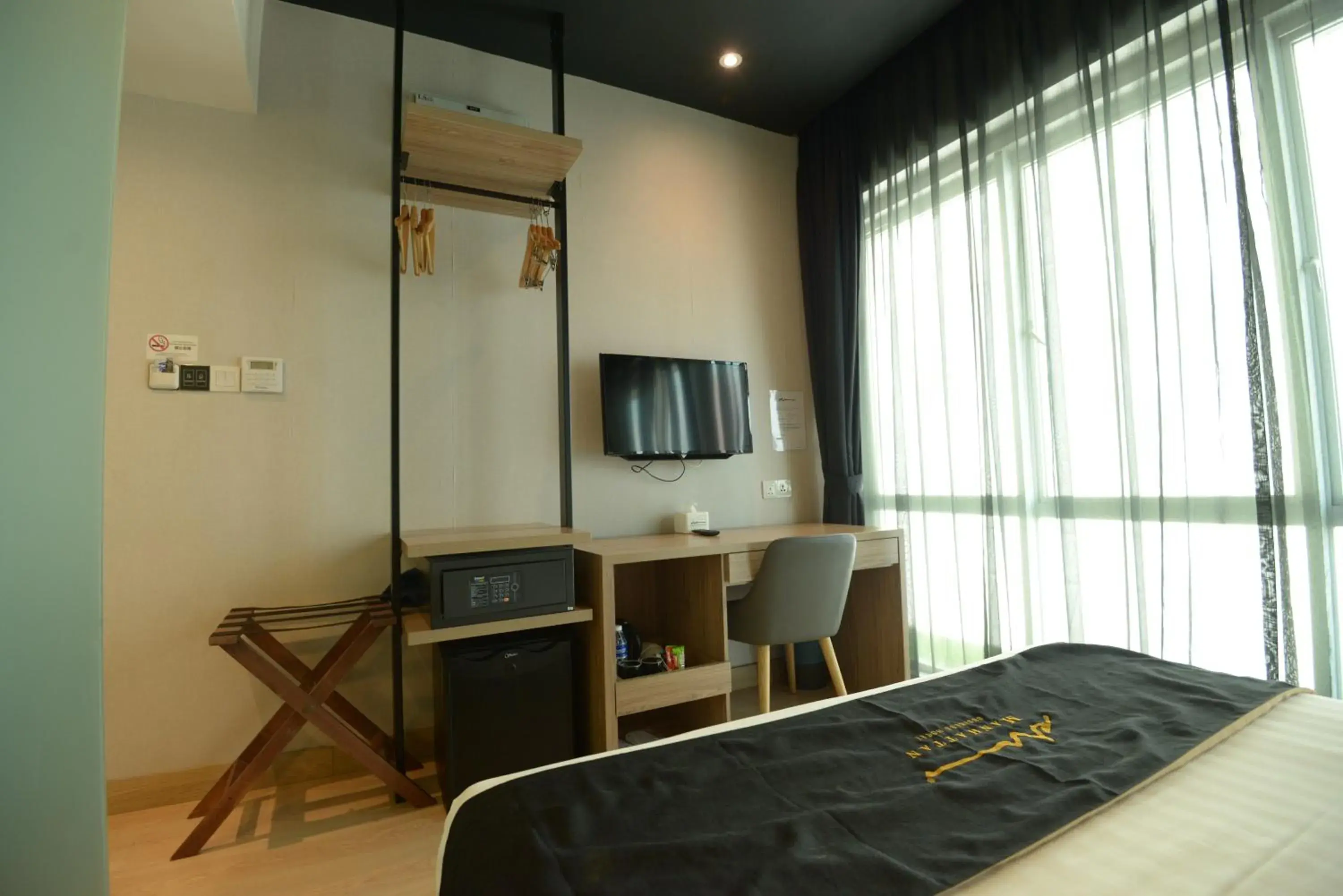 Bed, TV/Entertainment Center in Manhattan Business Hotel TTDI