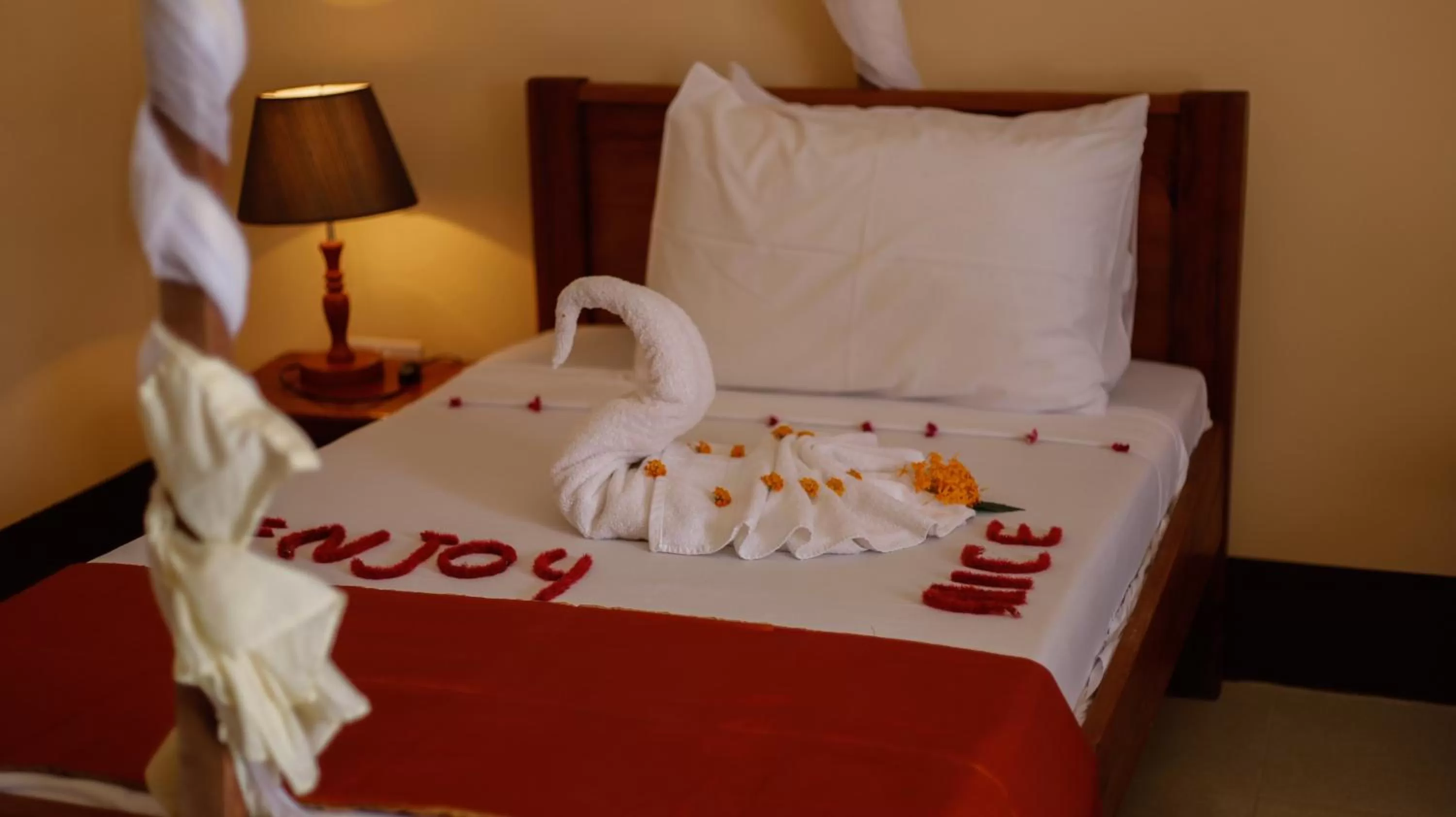 Bed in Amaan Beach Bungalows