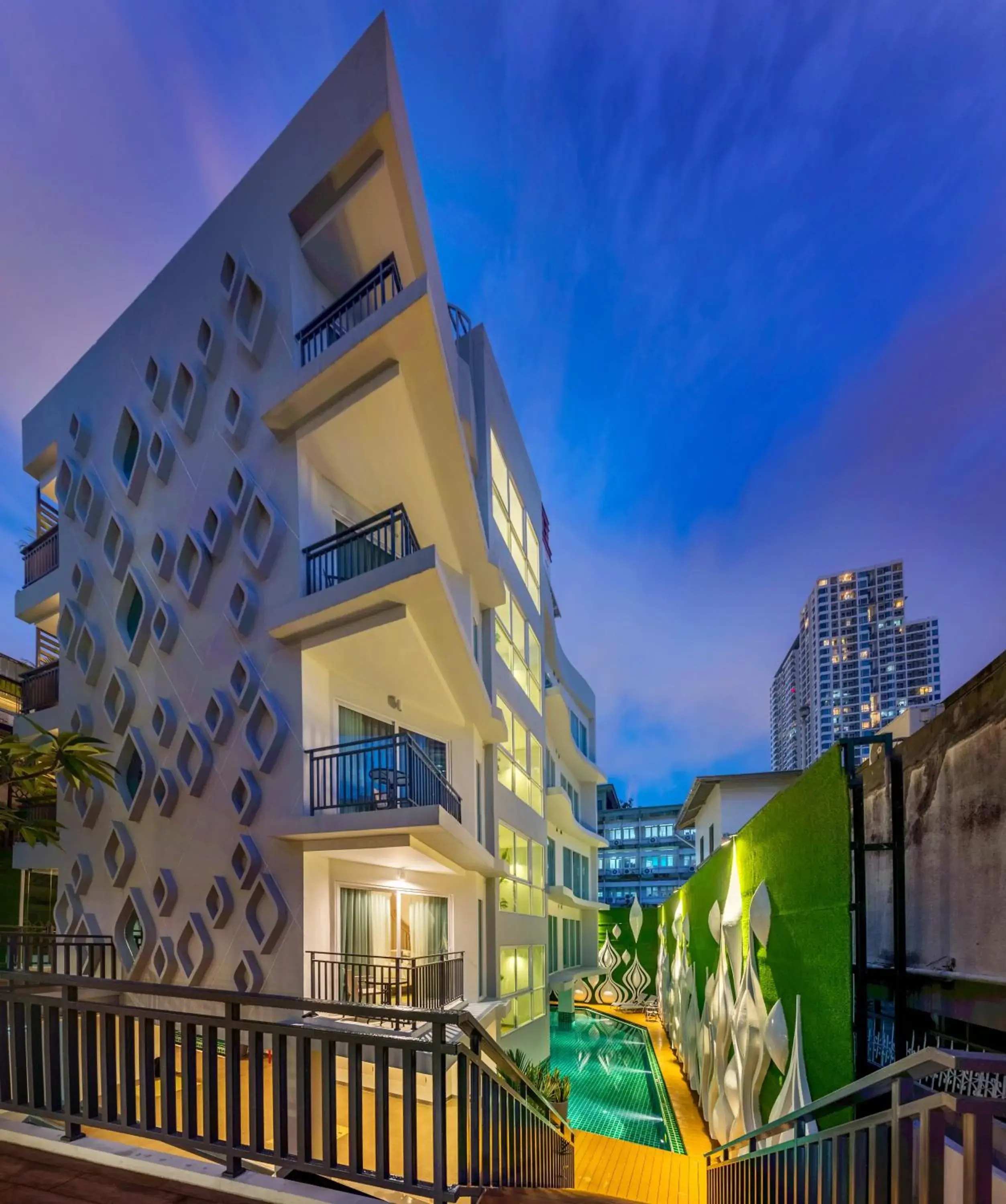 Swimming pool, Property Building in Anajak Bangkok Hotel - SHA Plus