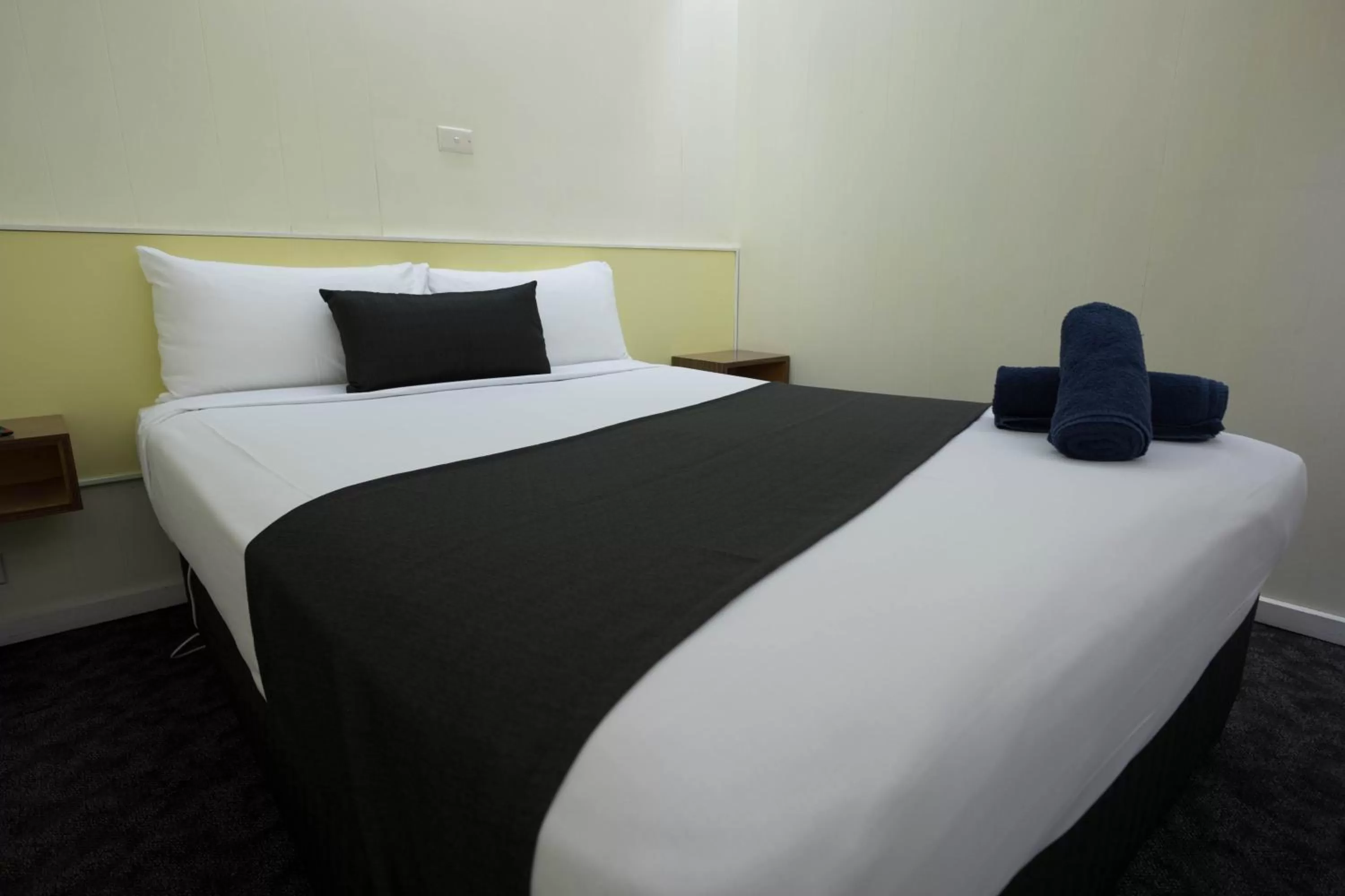 Bed in Pioneer Station Motor Inn