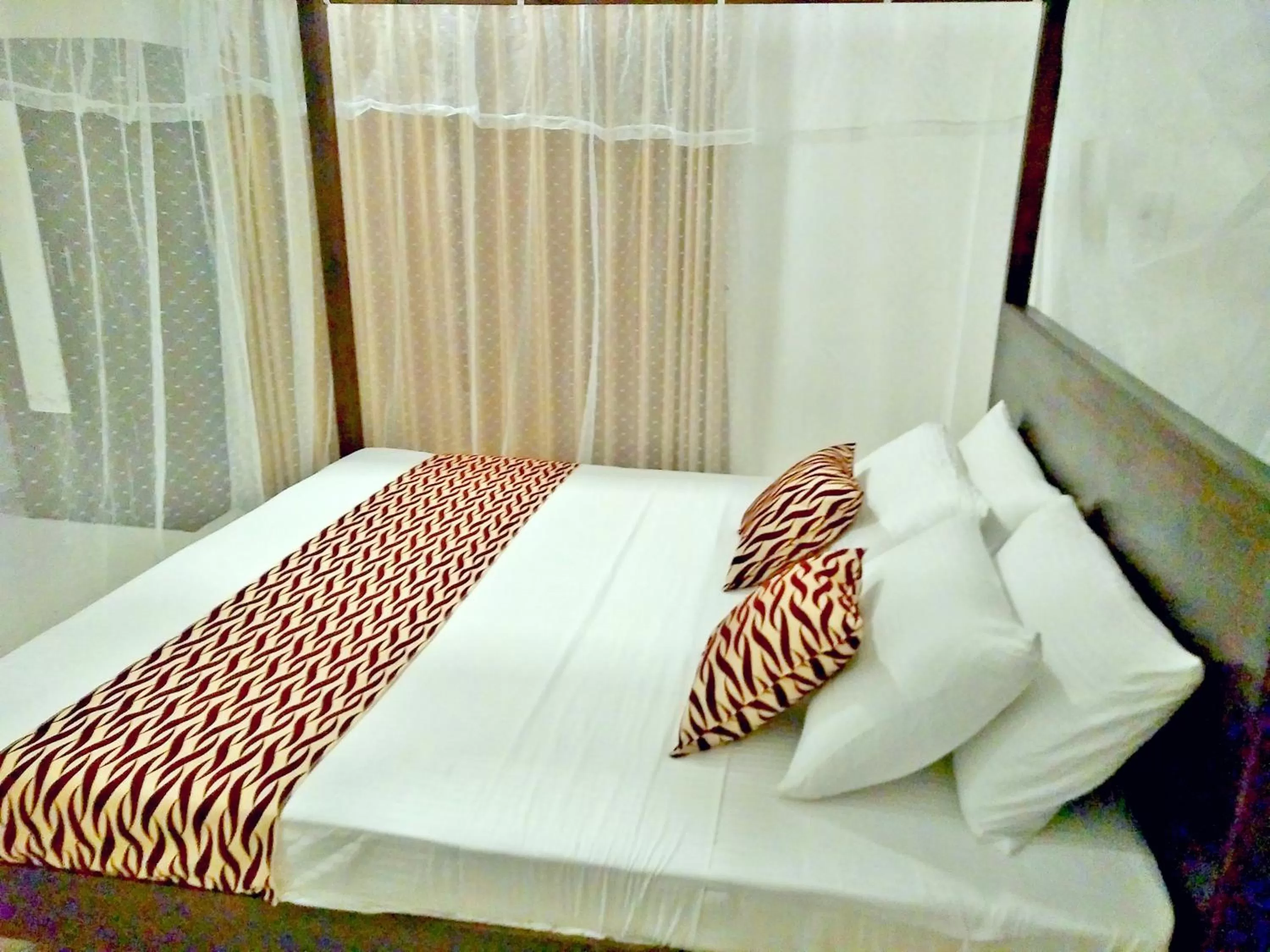 Bed in Ocean Bay Surf Resort Weligama
