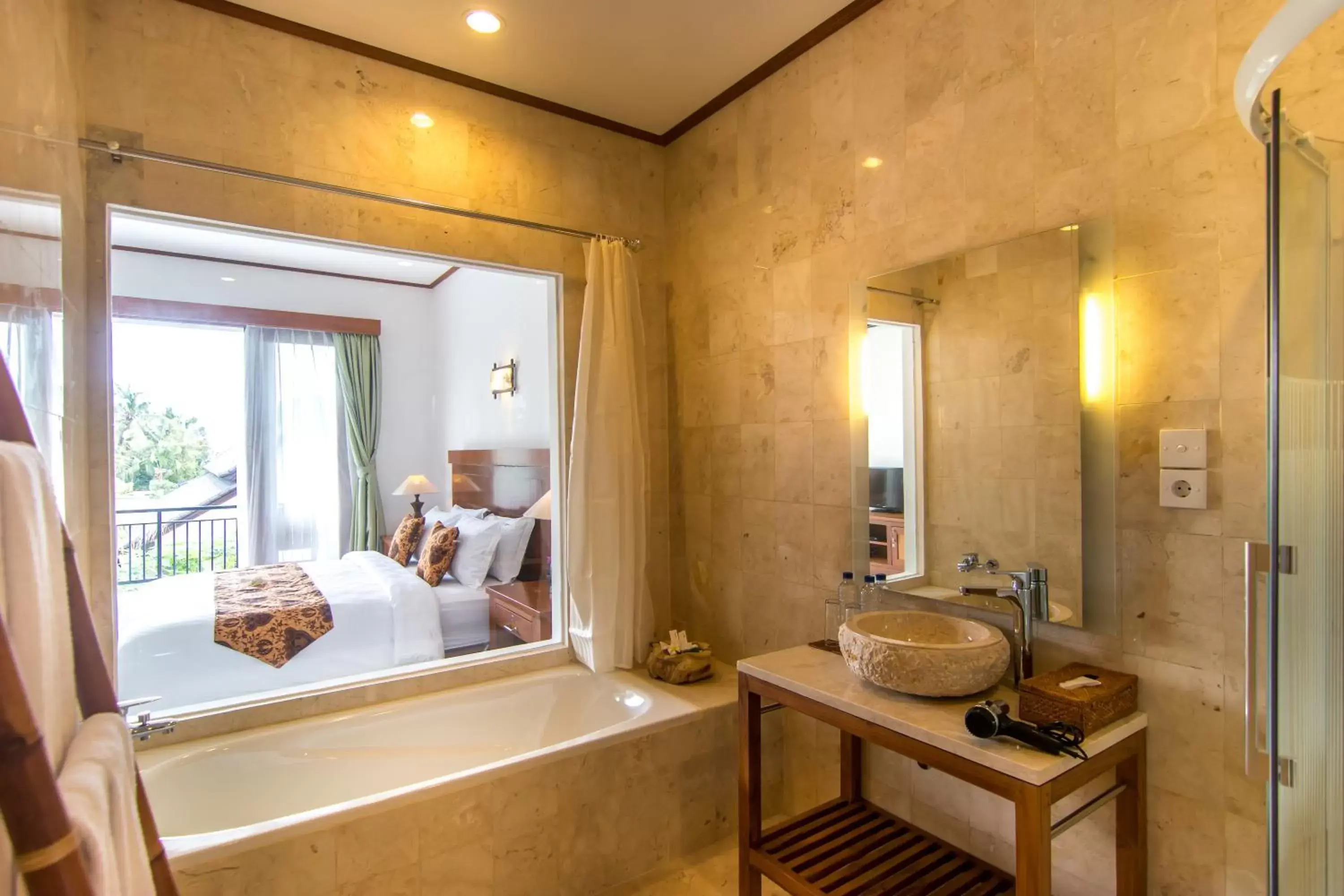 Bathroom in Gita Maha Ubud Hotel by Mahaputra-CHSE Certified