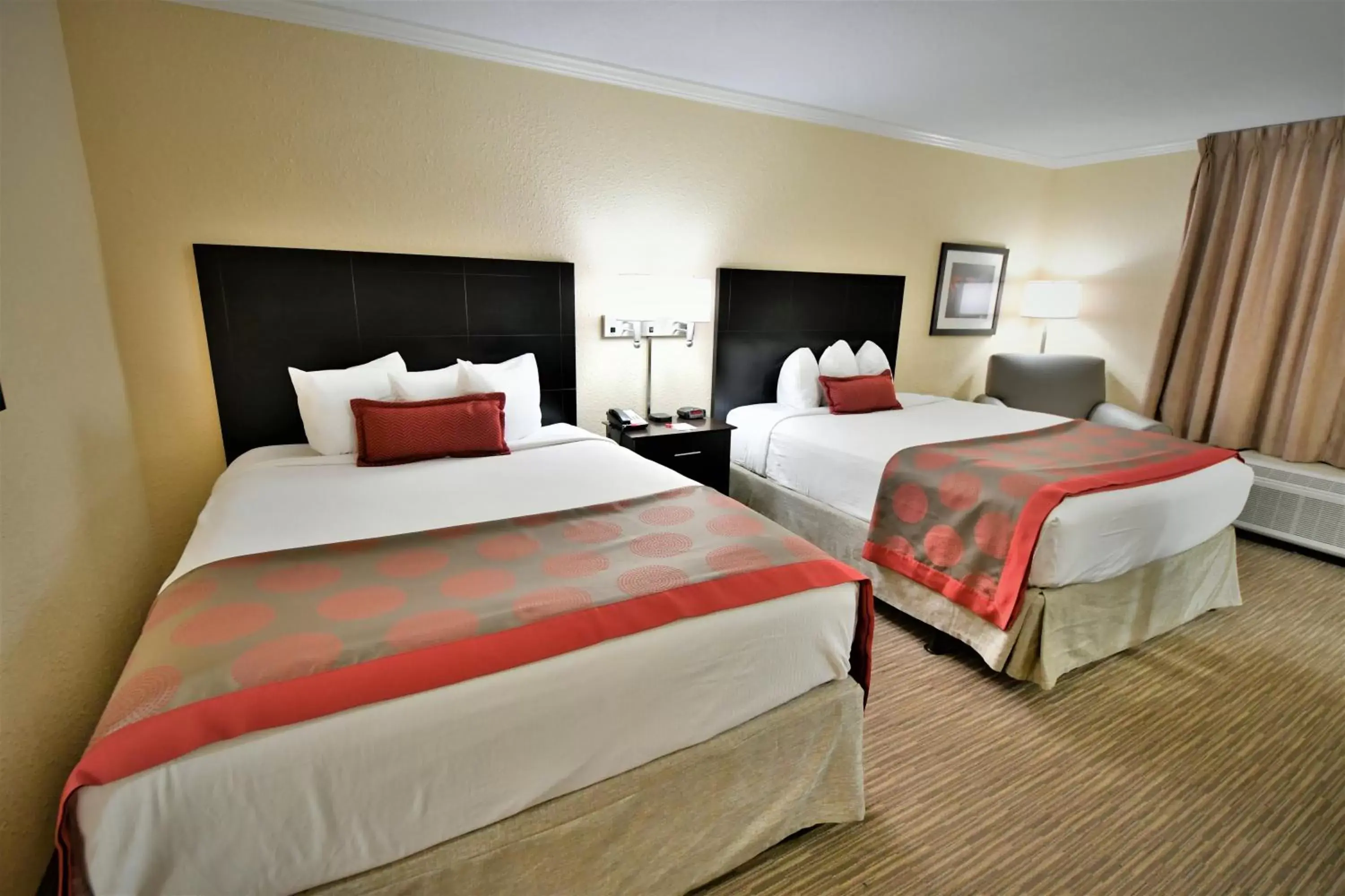 Bed in Ramada by Wyndham Jacksonville Hotel & Conference Center