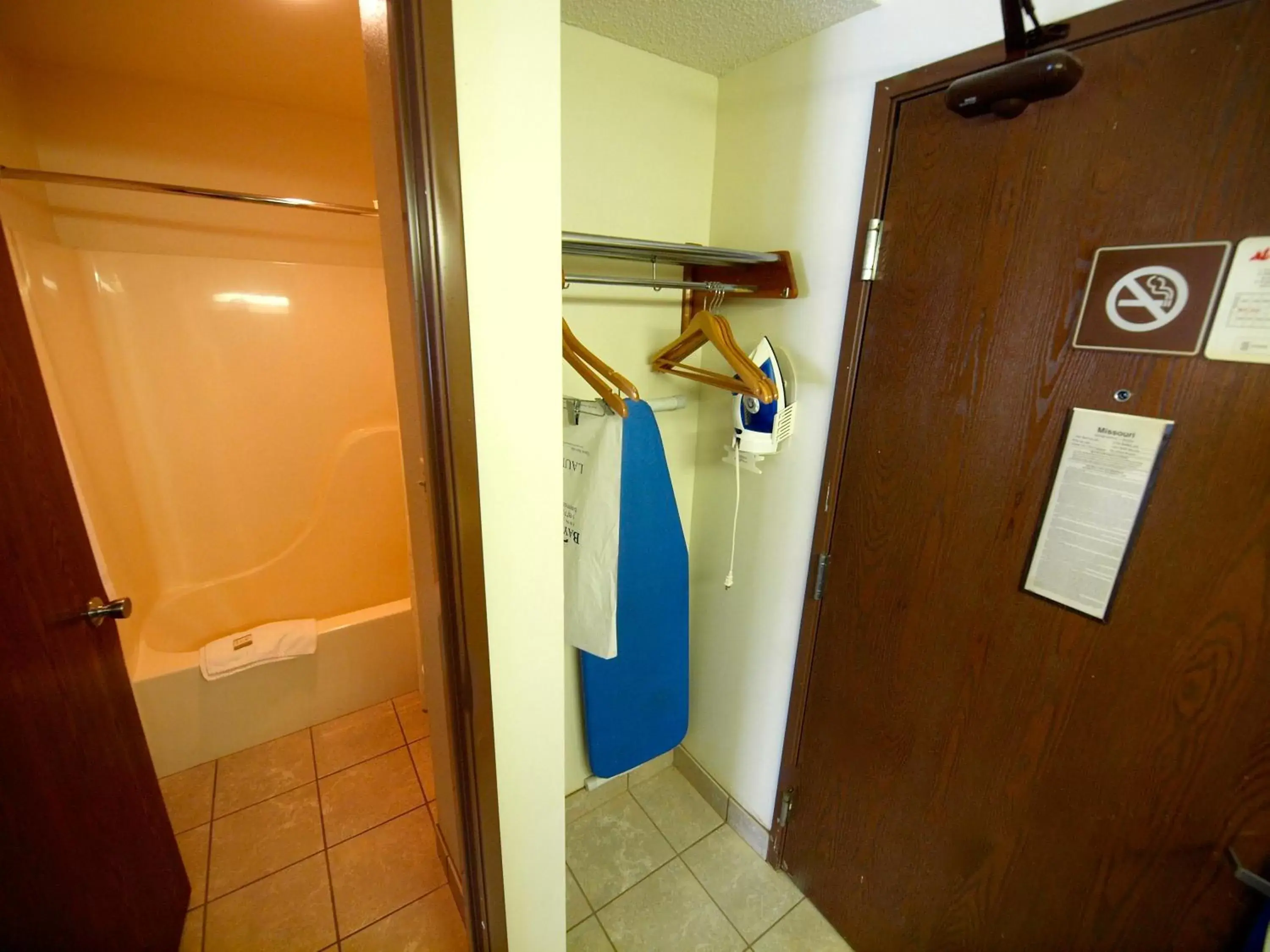 Bathroom in Days Inn & Suites by Wyndham Kansas City - Royals Stadium