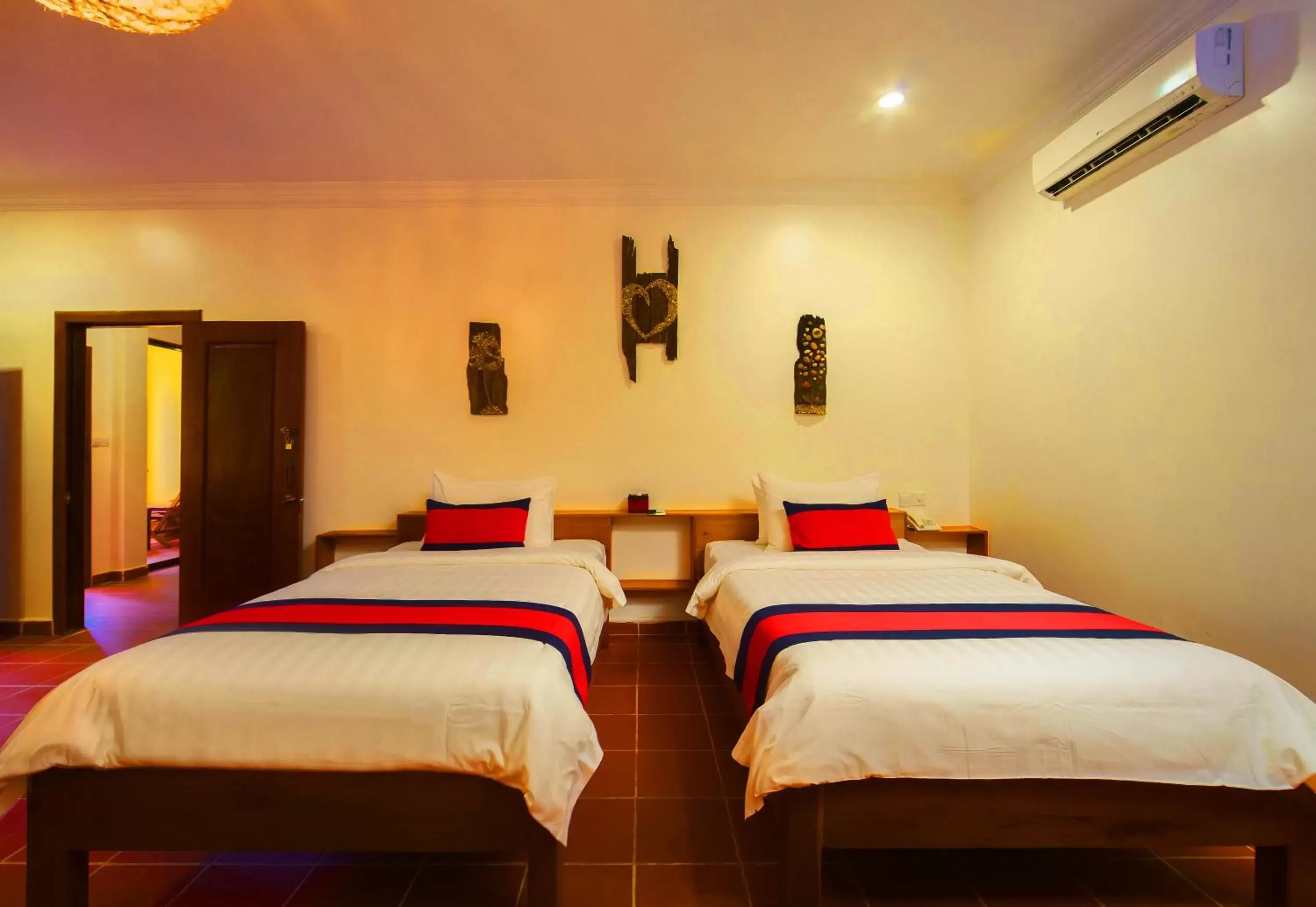 Bed in Le Jardin d'Angkor Hotel & Resort