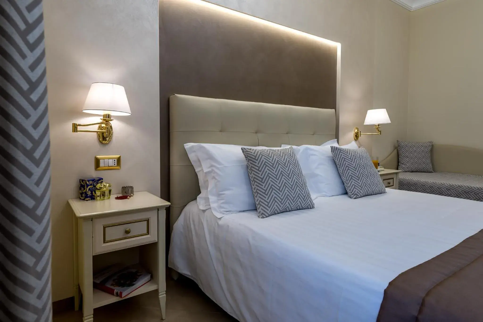 Bed in Vittorio Emanuele Boutique Hotel