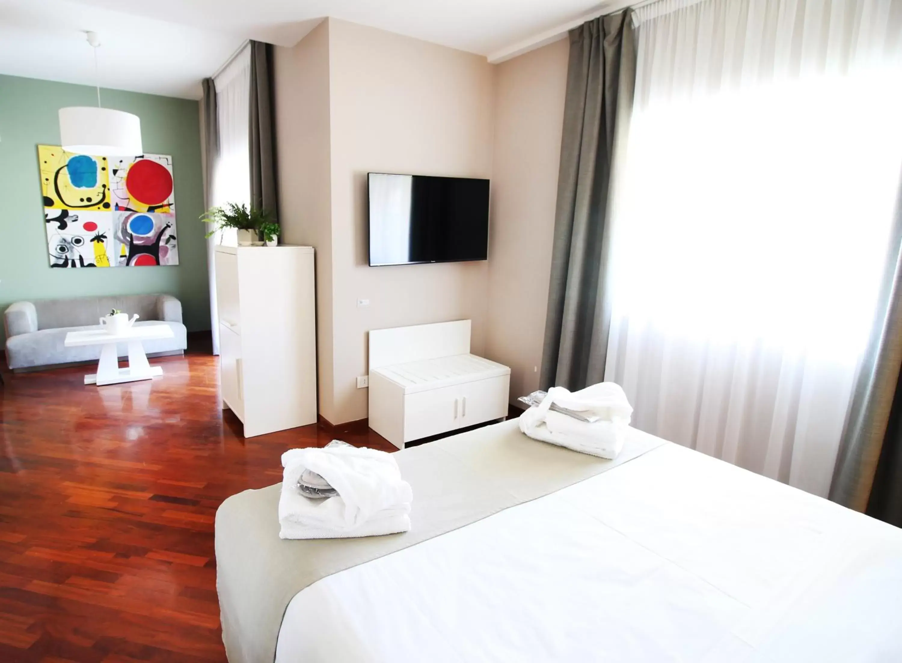 Bed, TV/Entertainment Center in Regiohotel Manfredi