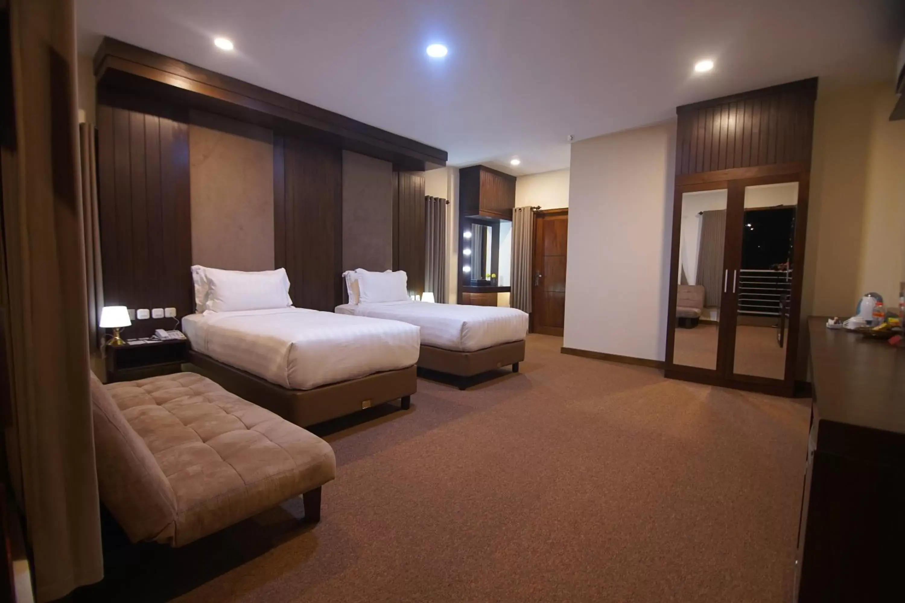 Bed in Grand Harvest Resort & Villas