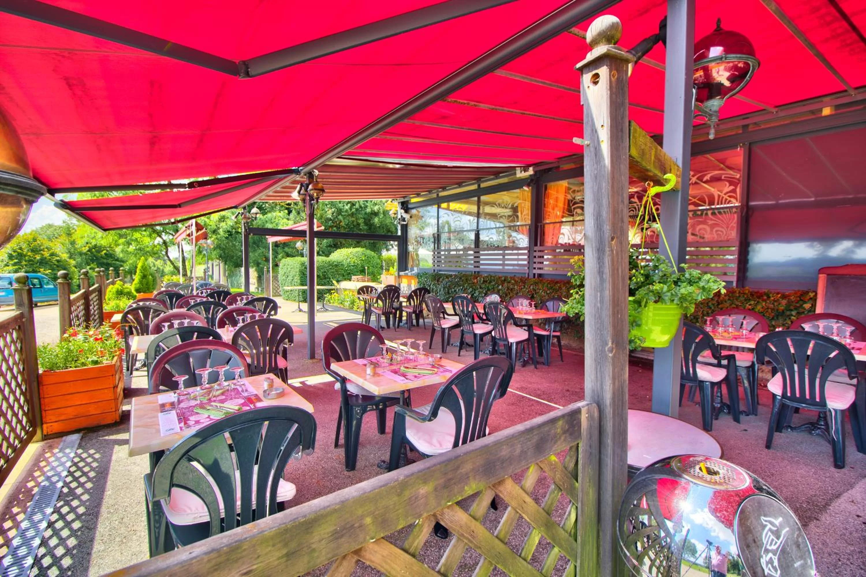 Patio in Logis Hôtel Restaurant Le Chalet du Mont Roland
