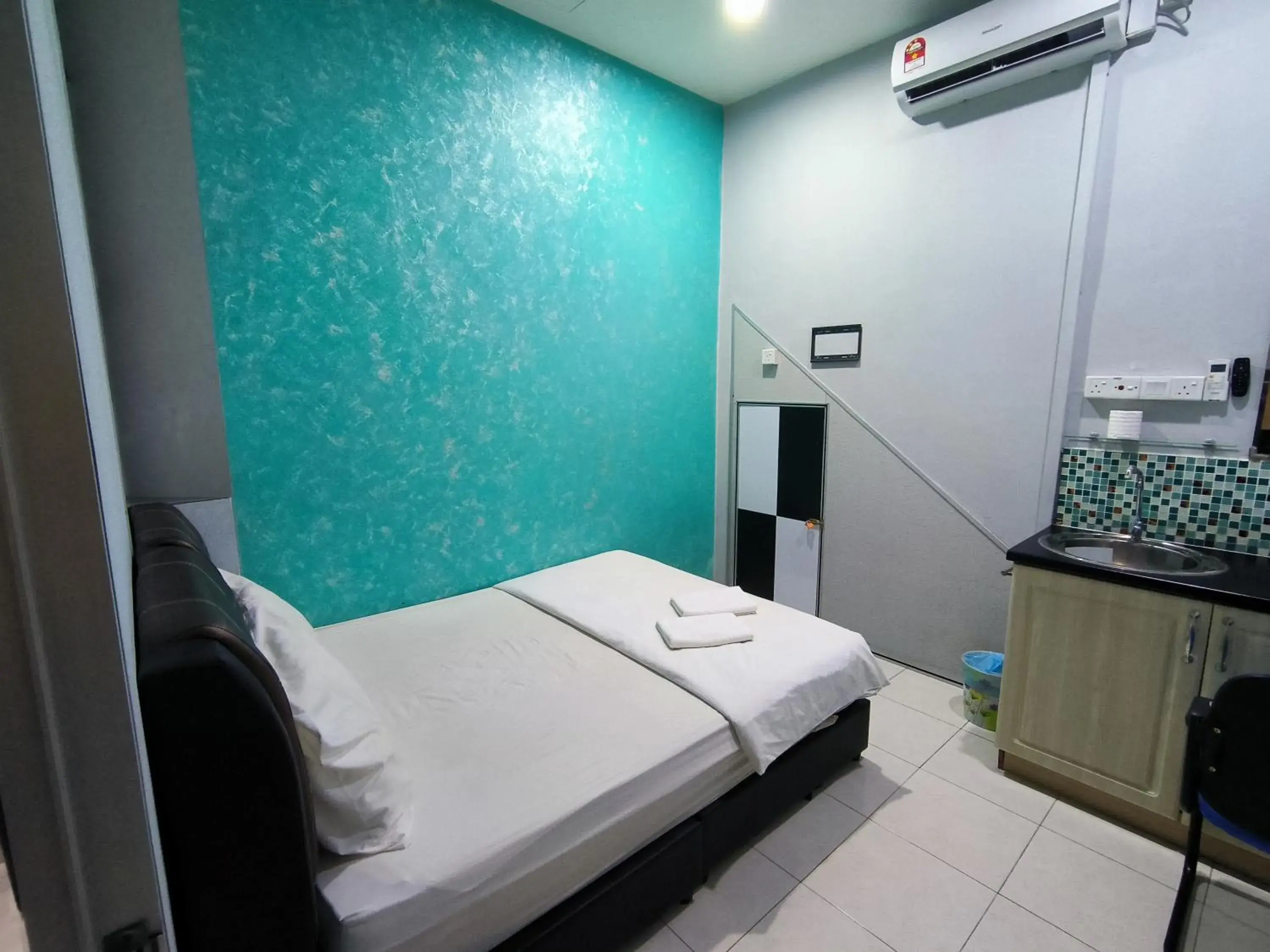 Bed in GOLDEN GUEST HOUSE KUANTAN