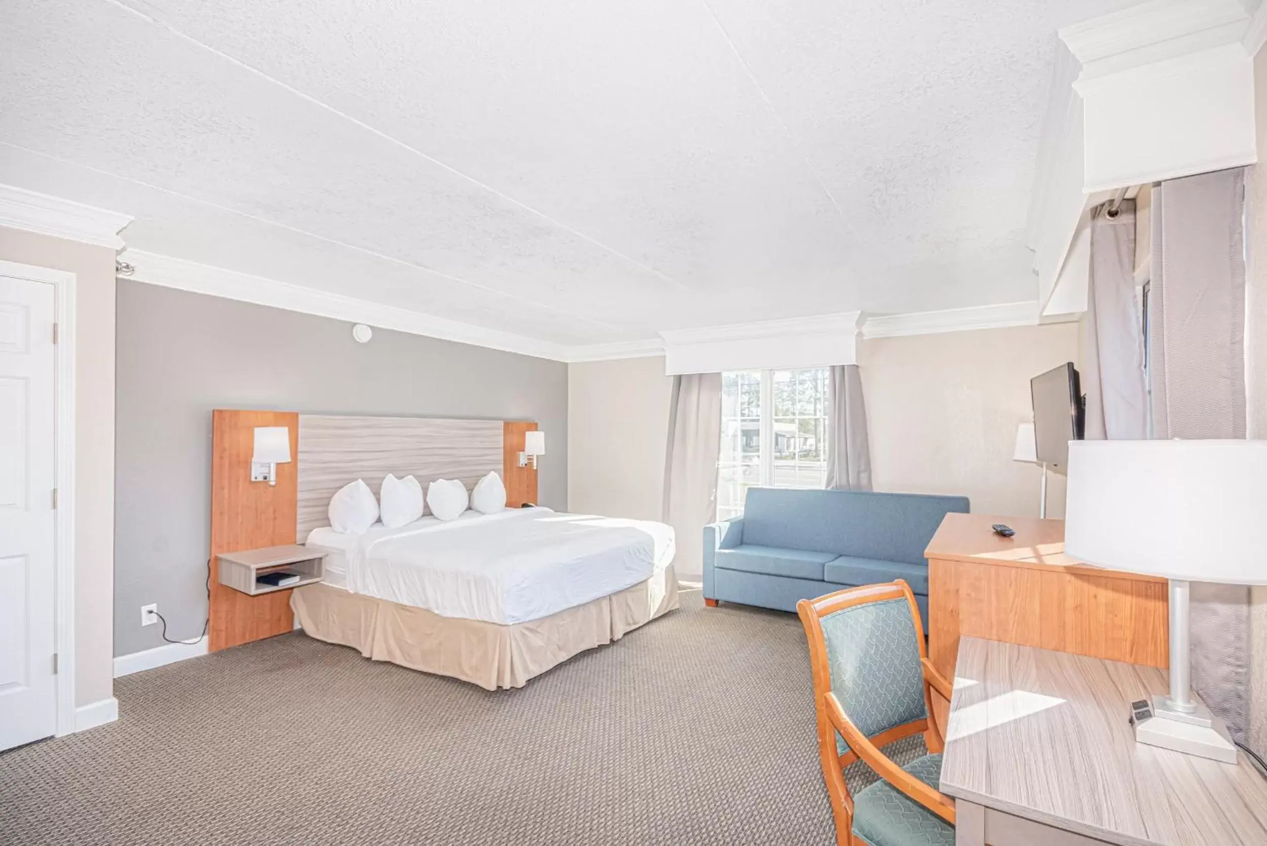 Bed in Casa Bella Inn & Suites