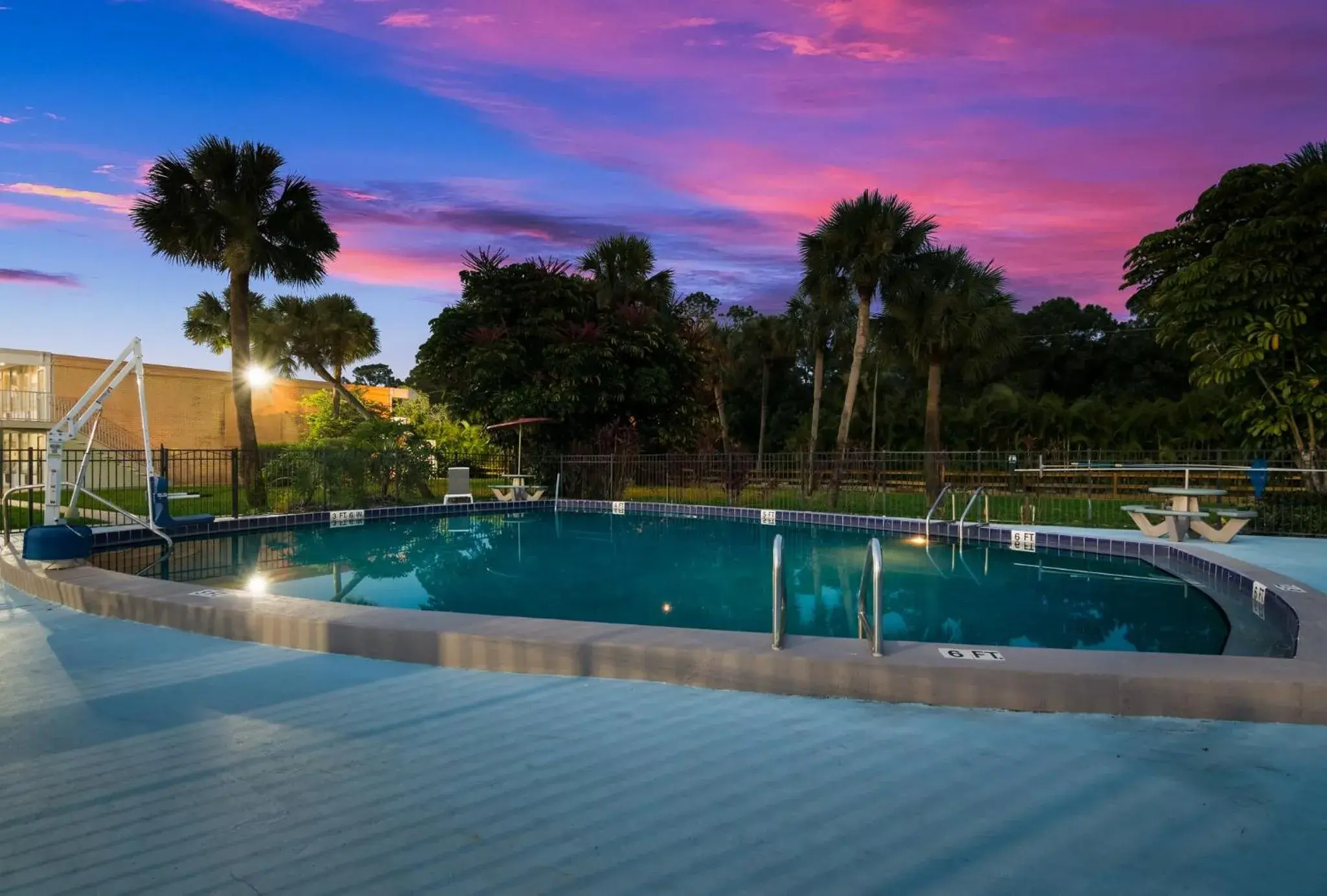 Property building, Swimming Pool in HomeTowne Studios by Red Roof Vero Beach - I-95