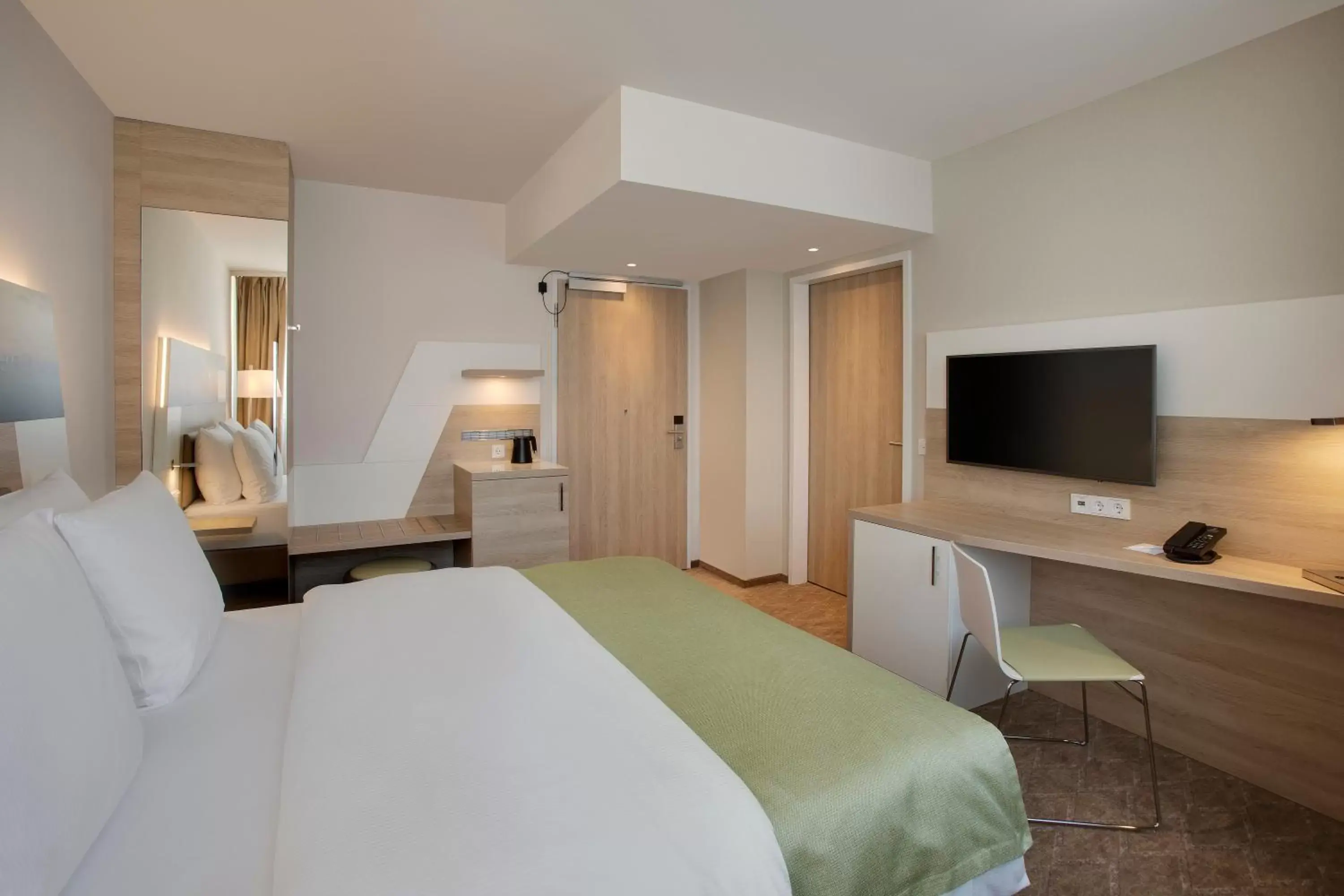 Photo of the whole room, TV/Entertainment Center in Holiday Inn Frankfurt Airport, an IHG Hotel