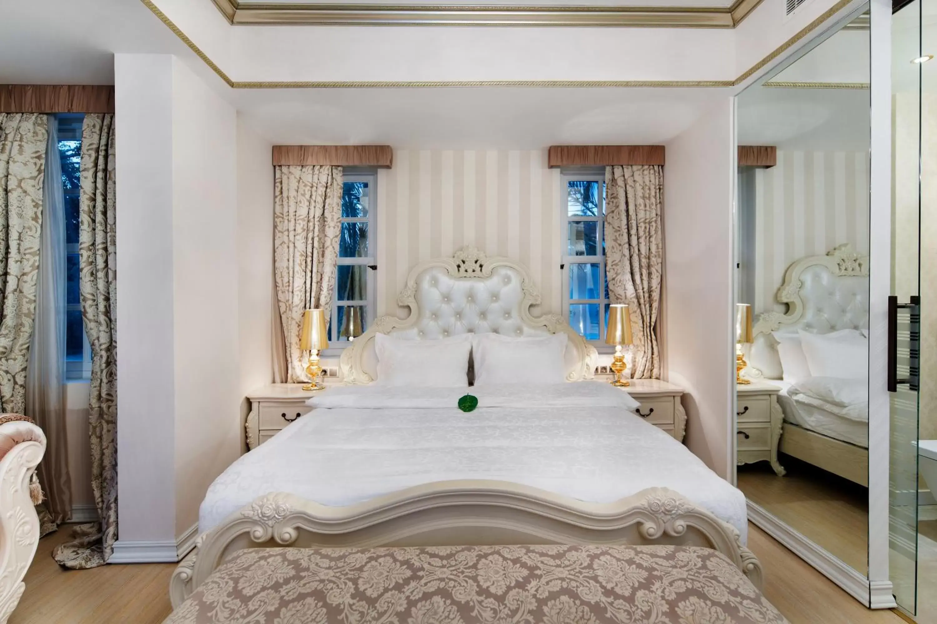 Bed in Elegance East Hotel