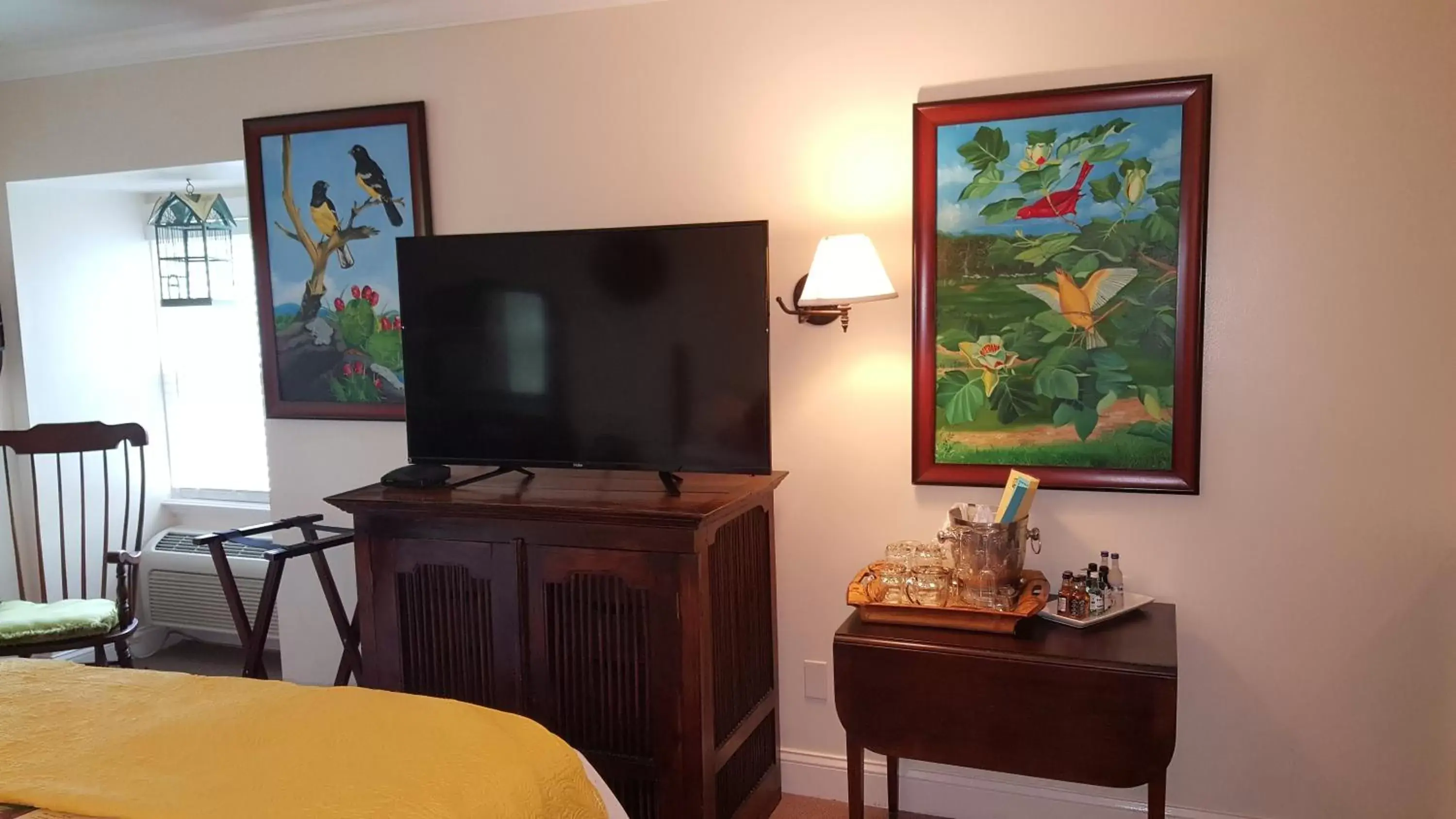 Photo of the whole room, TV/Entertainment Center in The Caribbean Court Boutique Hotel