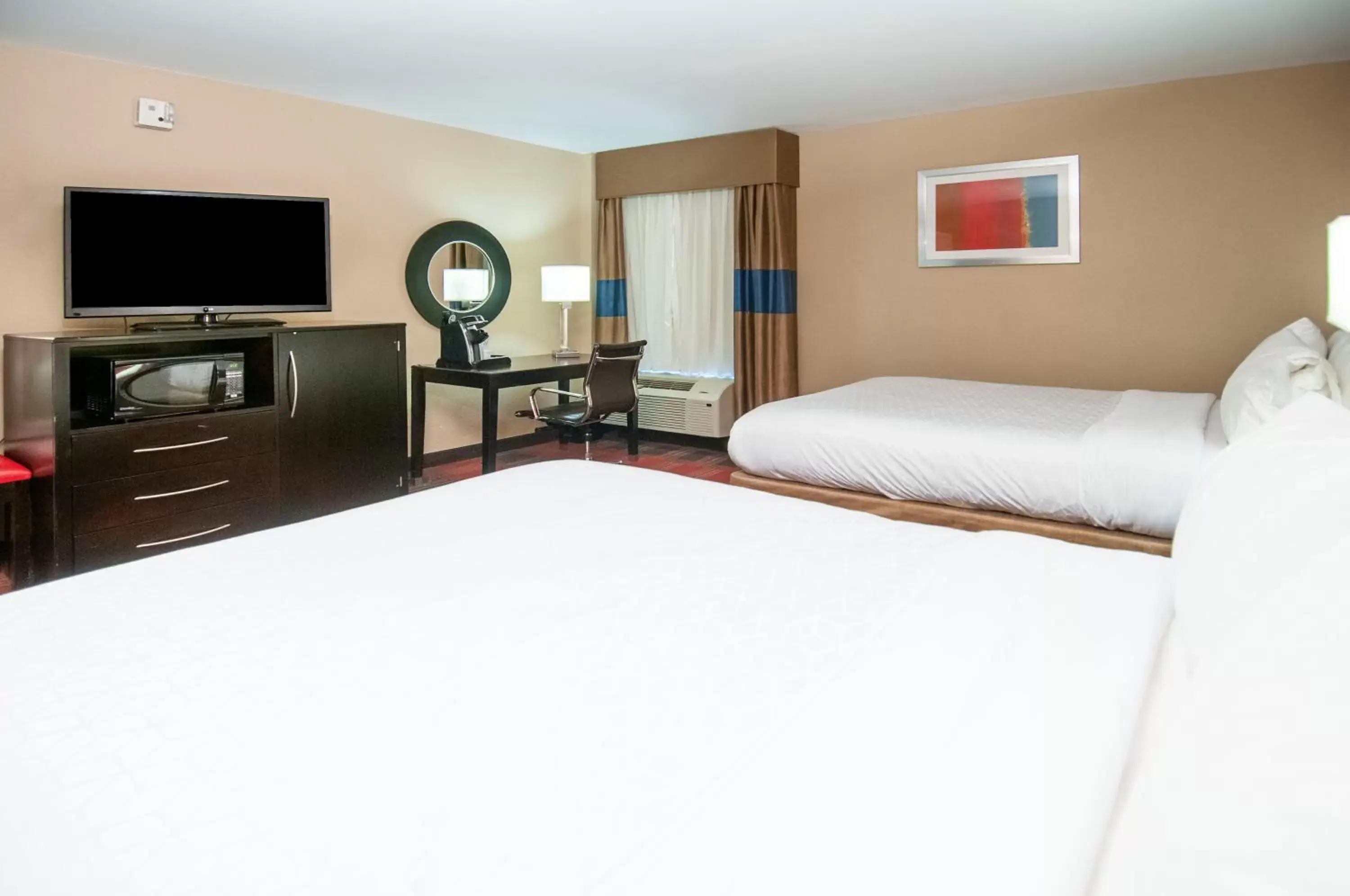 Bed in Holiday Inn Express & Suites Jackson Downtown - Coliseum, an IHG Hotel