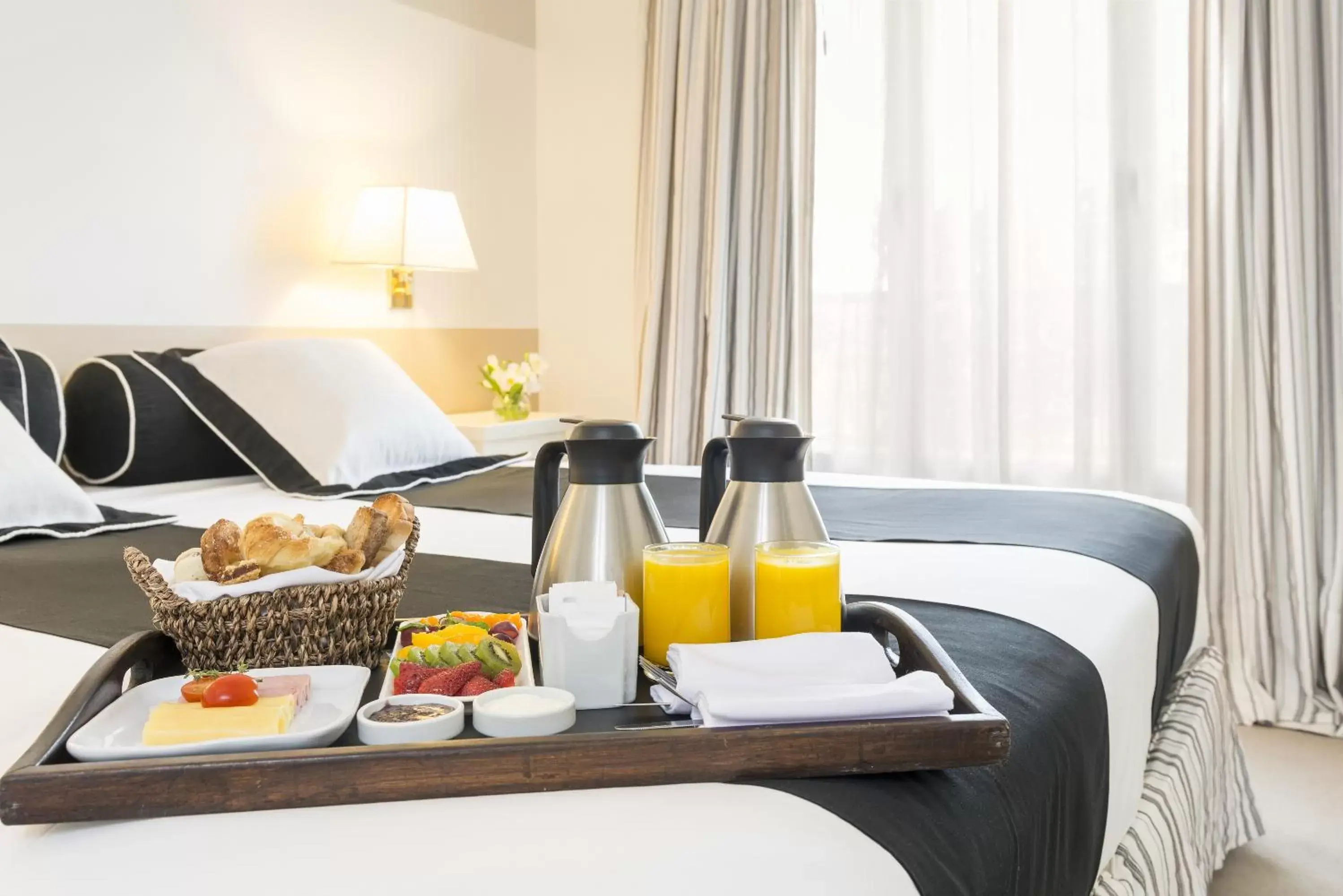 Bed in Loi Suites Recoleta Hotel