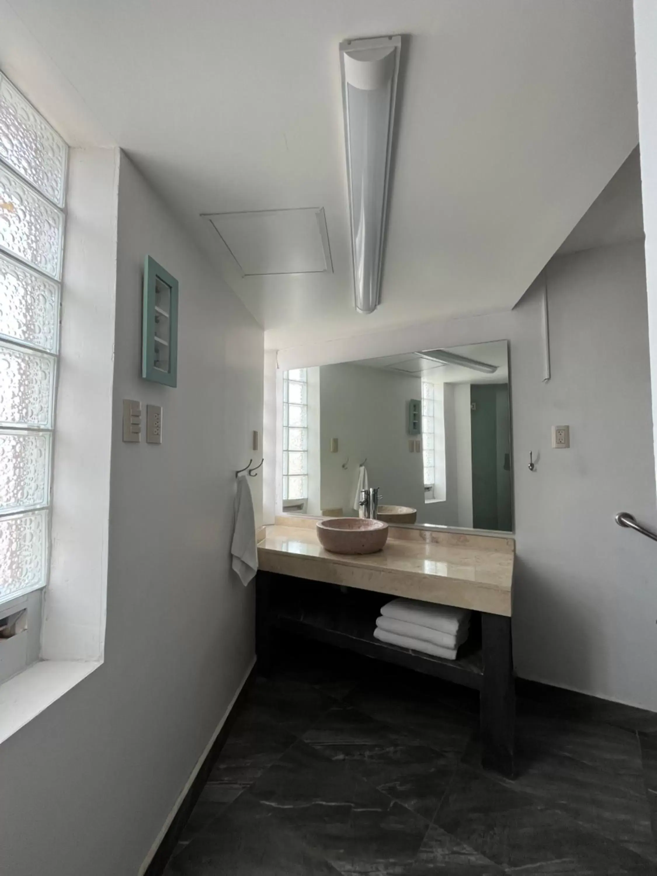 Bathroom in Genesis Suites / Lofts