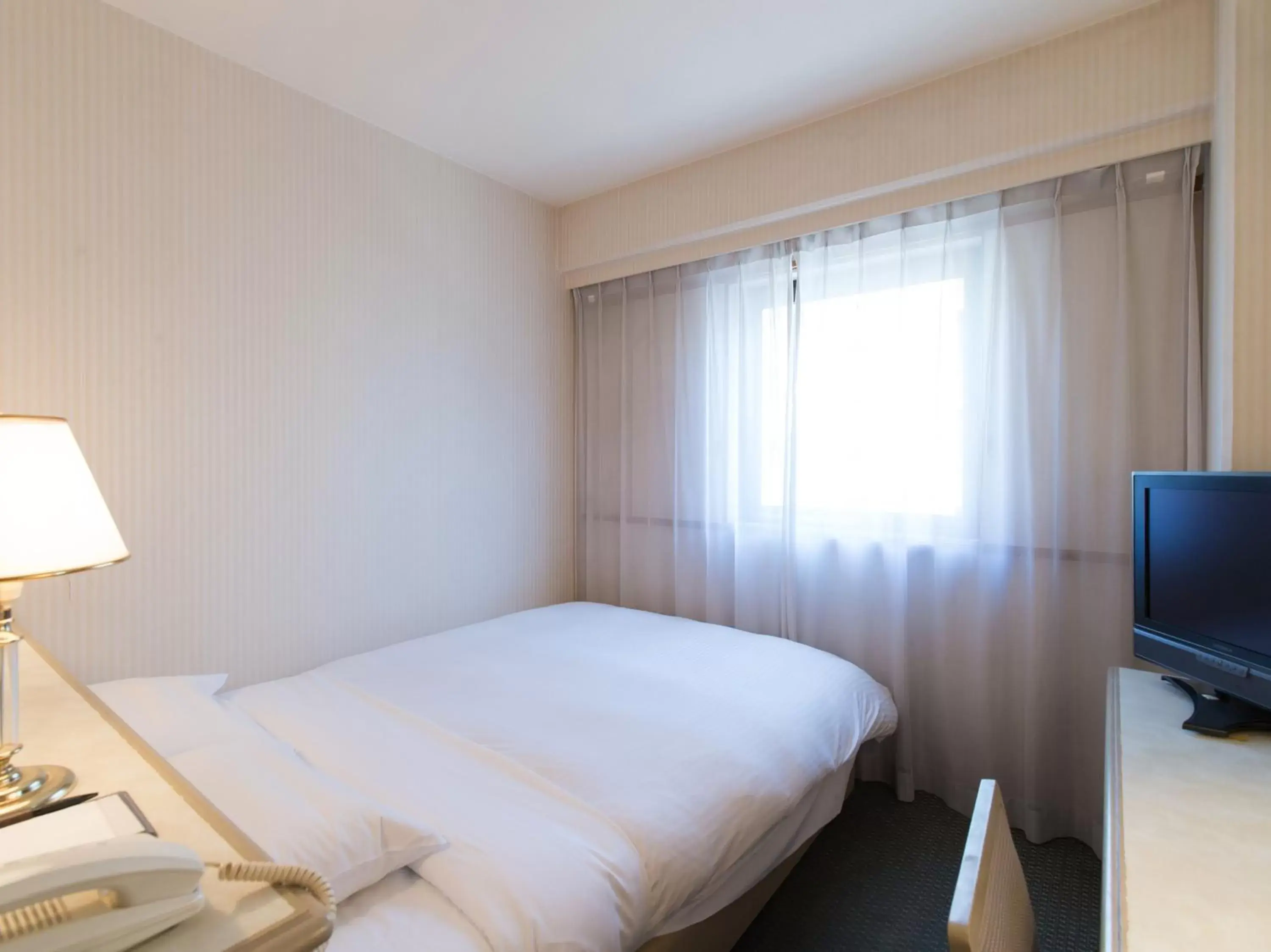 Photo of the whole room, Bed in Tabist Hotel Tetora Kitakyushu