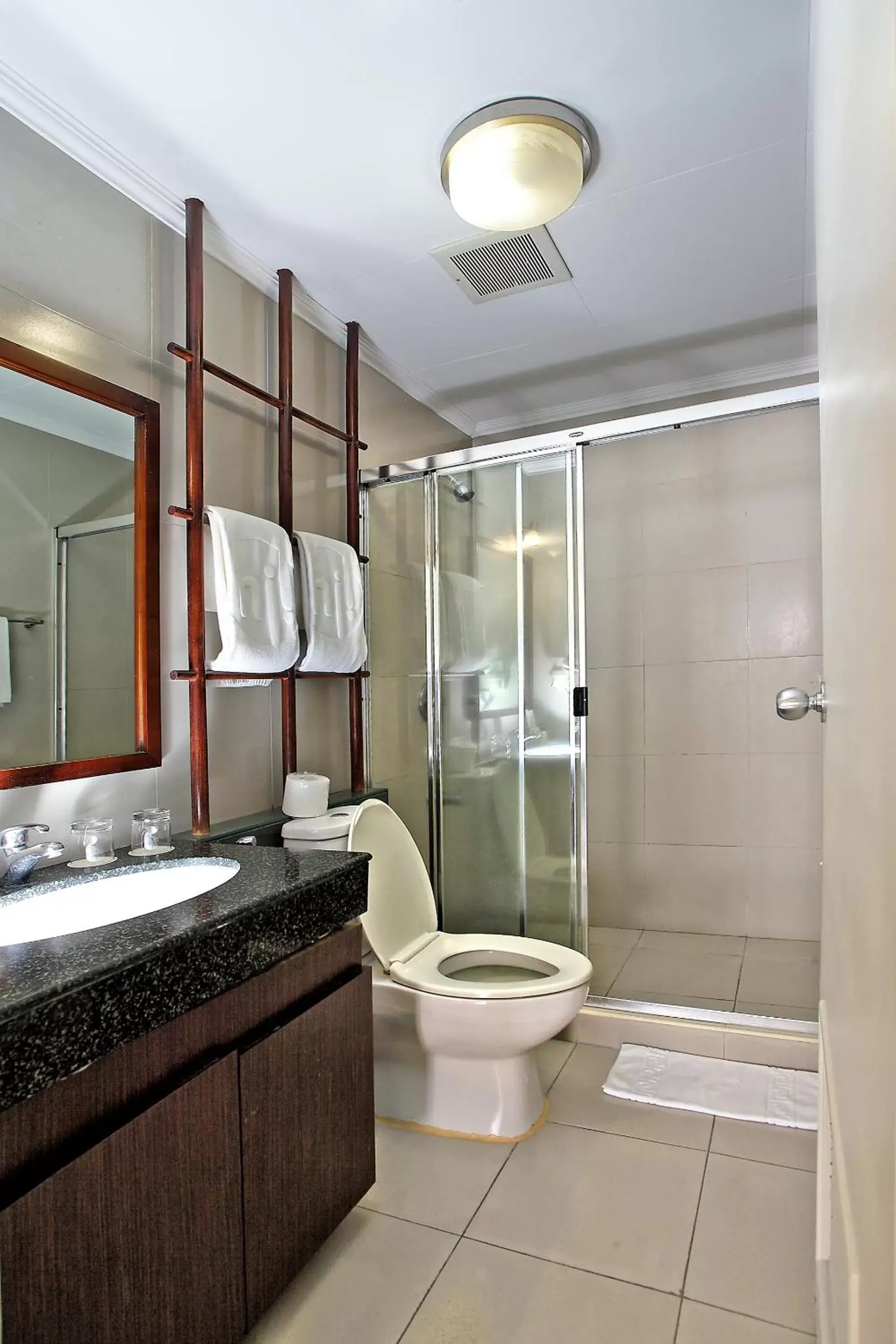 Toilet, Bathroom in Parque España Residence Hotel Managed by HII