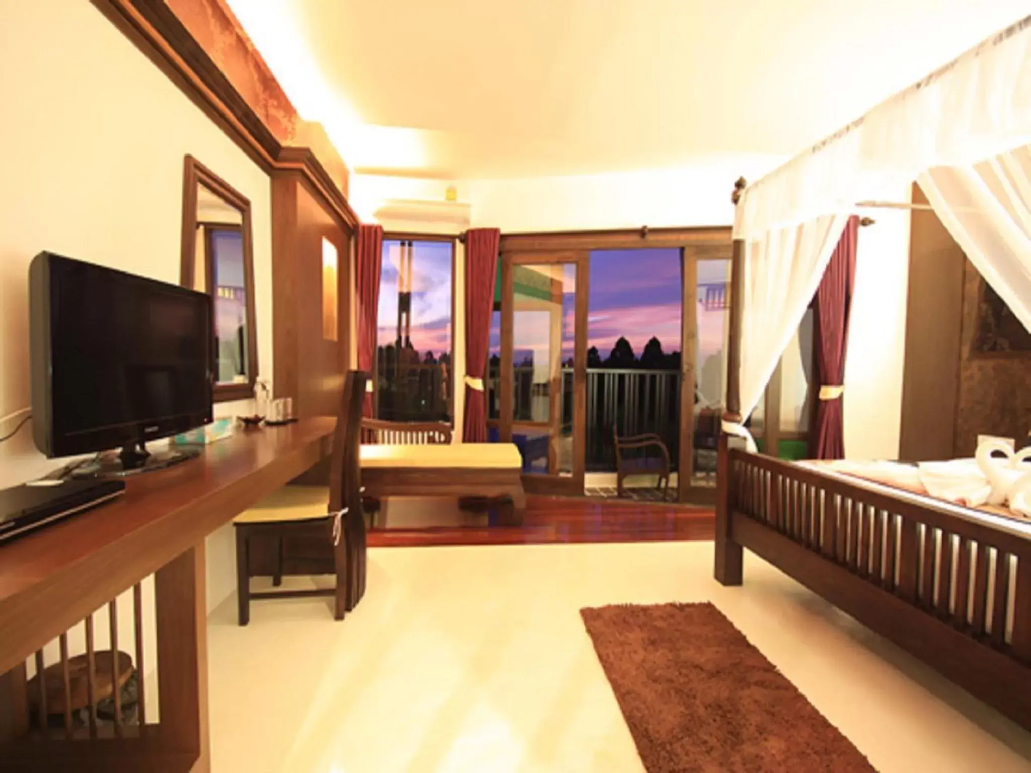 Photo of the whole room, TV/Entertainment Center in Dee Andaman Hotel