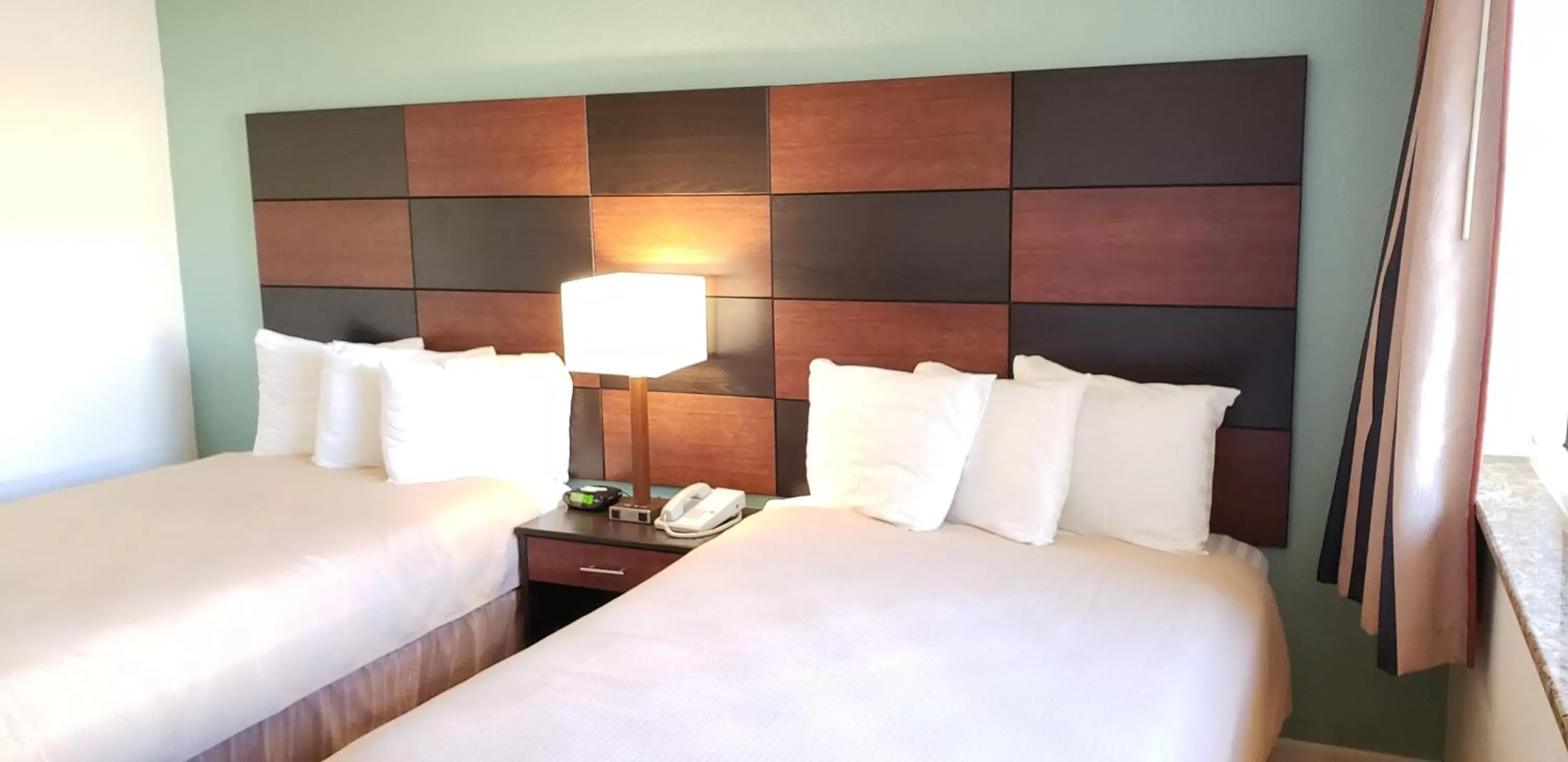 Bed in Oceanfront Inn and Suites - Ormond