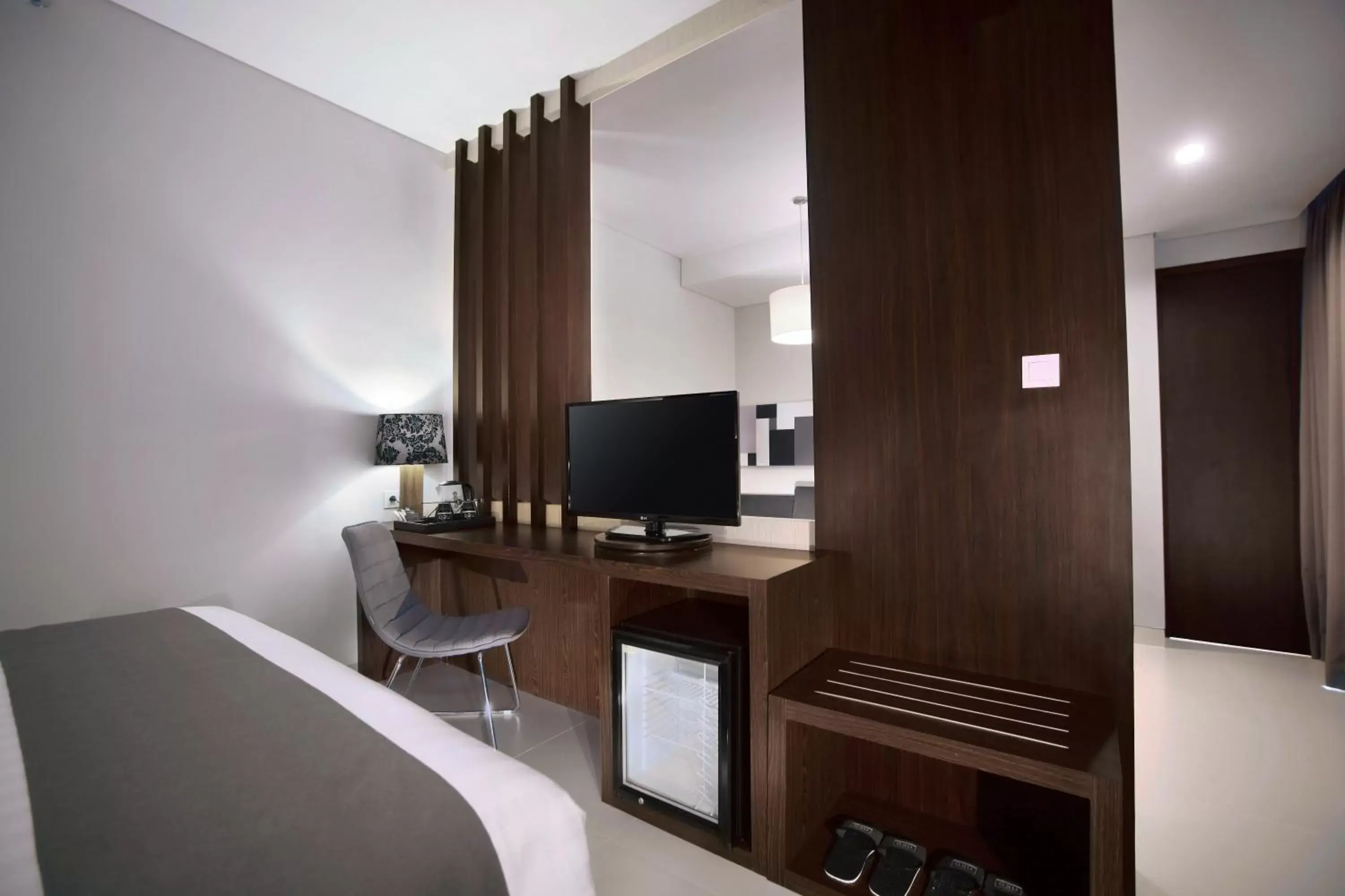 Photo of the whole room, TV/Entertainment Center in Neo Denpasar by ASTON