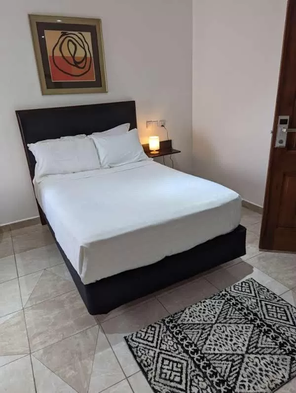 Bed in KoKo Palm Inn LTD