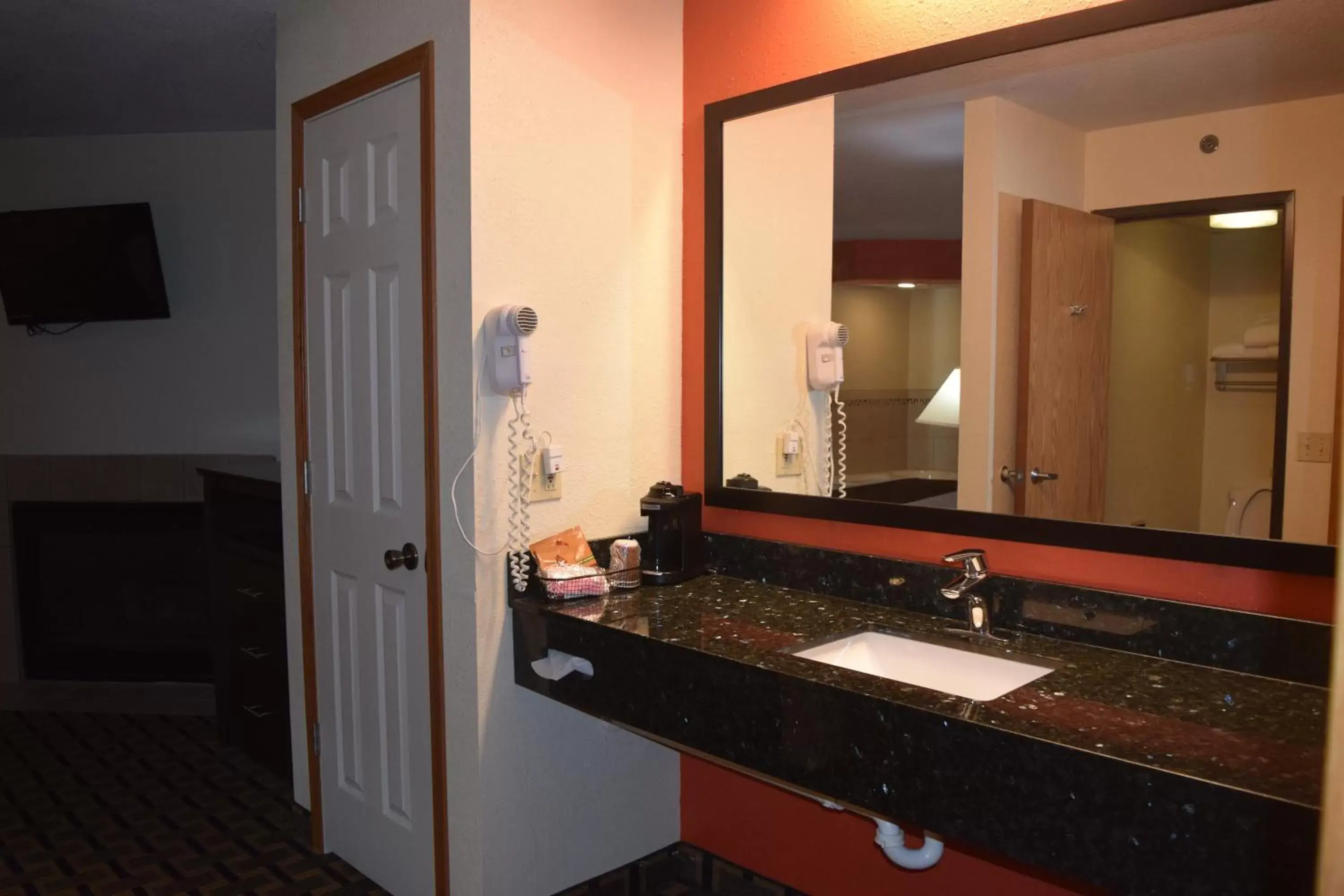 Bathroom in AmericInn by Wyndham West Burlington