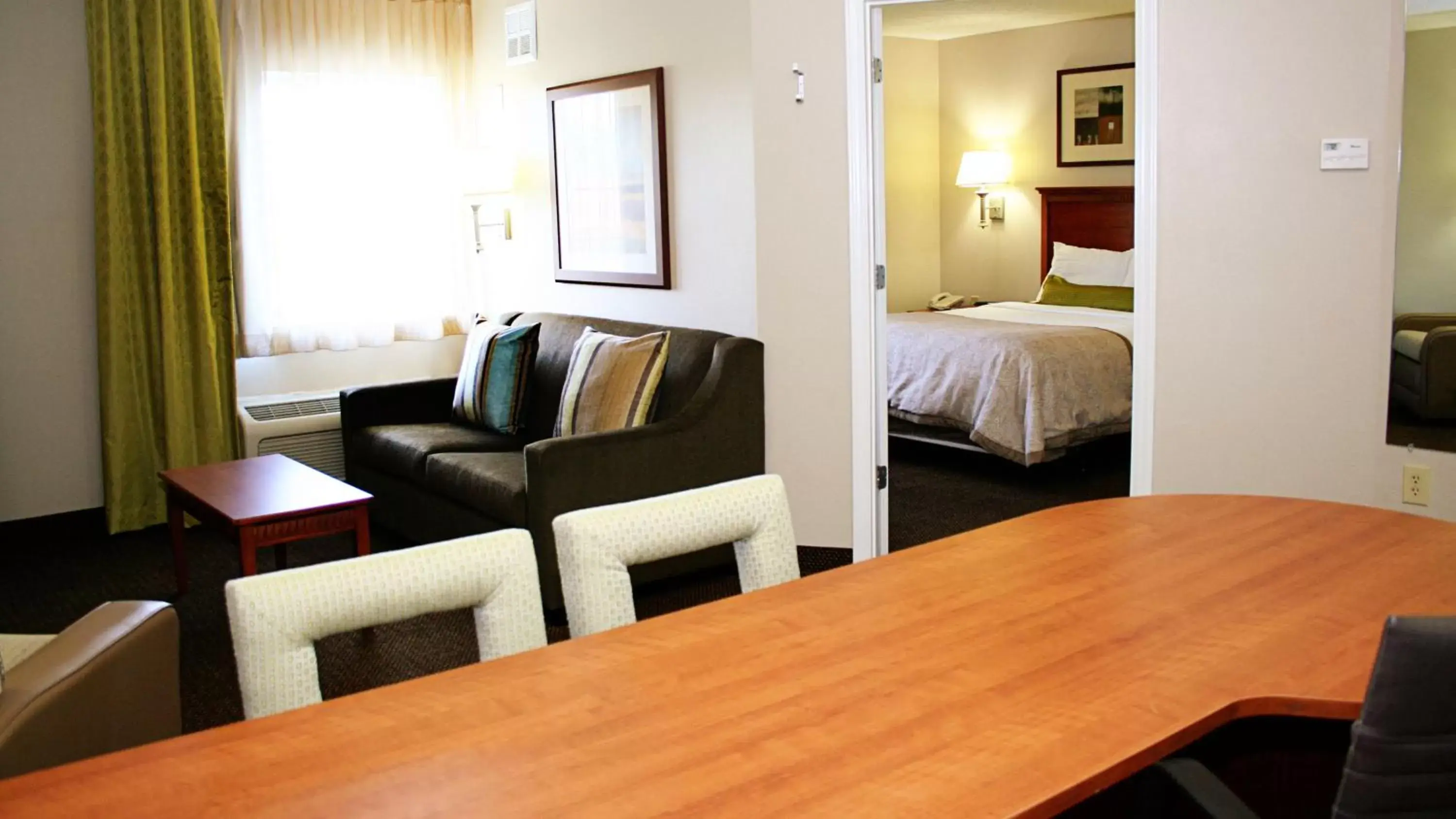 Bedroom, Seating Area in Candlewood Suites Harrisonburg, an IHG Hotel