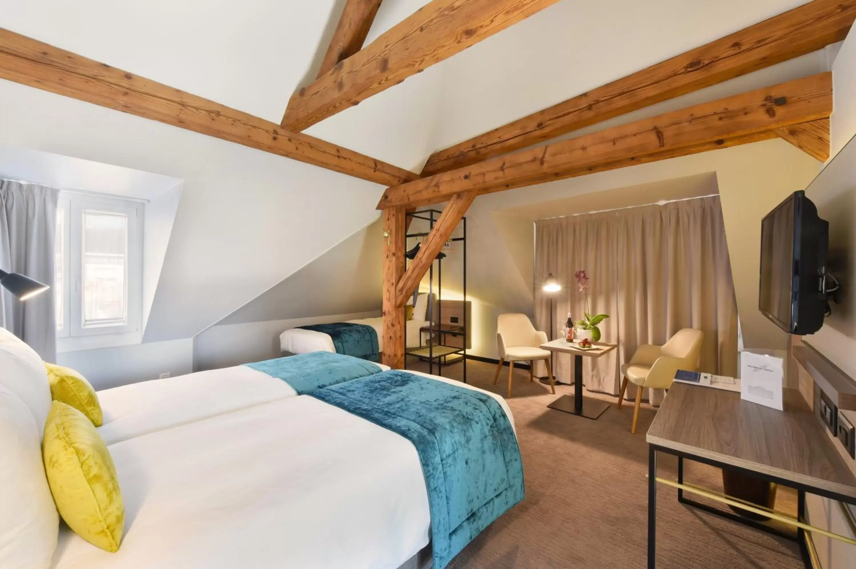 Bed in Astra Vevey Hotel & Restaurant