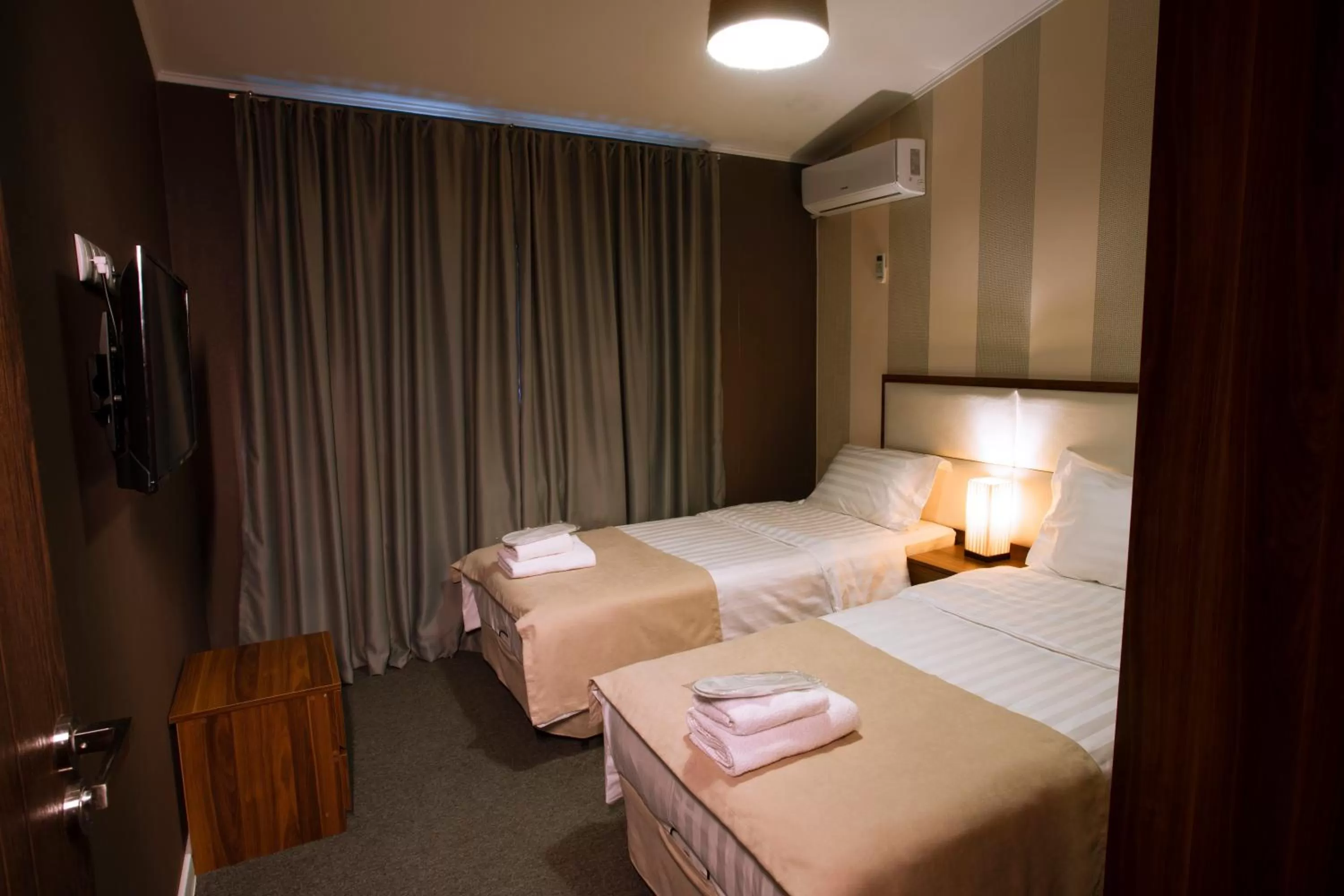 Bed in Apart Hotel West