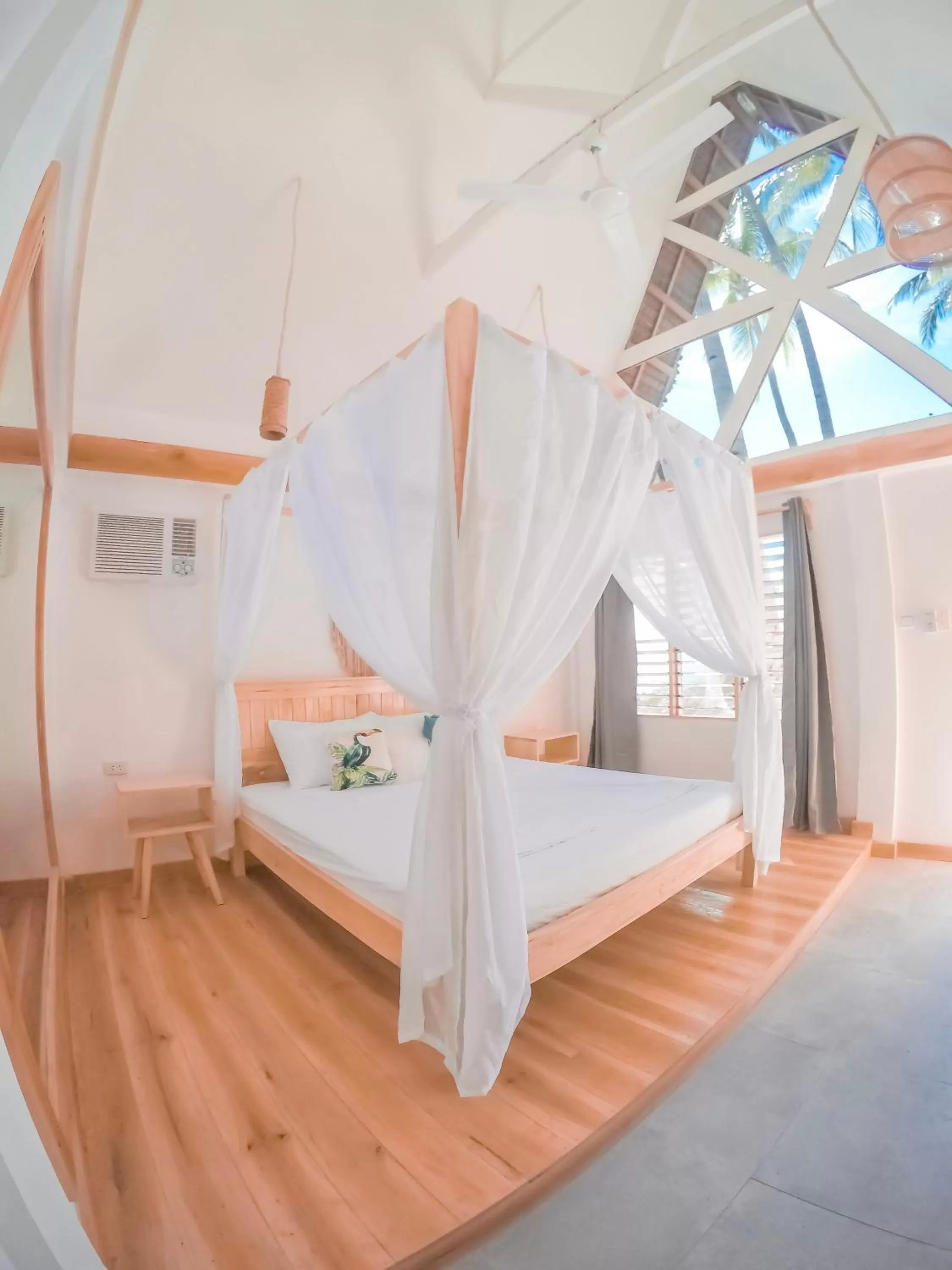 Bed in Bermuda Triangle Bungalows
