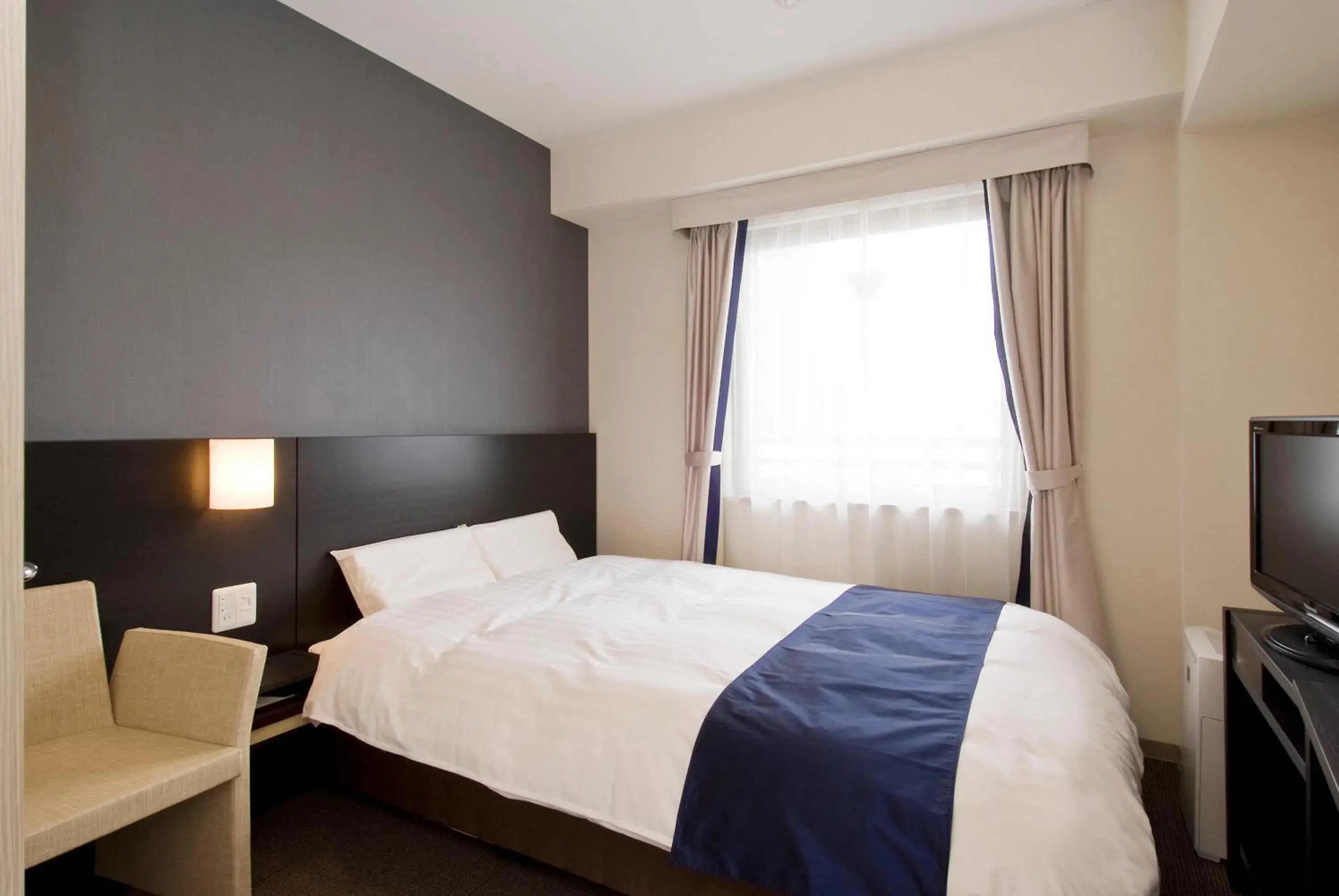 Bed in Dormy Inn Premium Shimonoseki