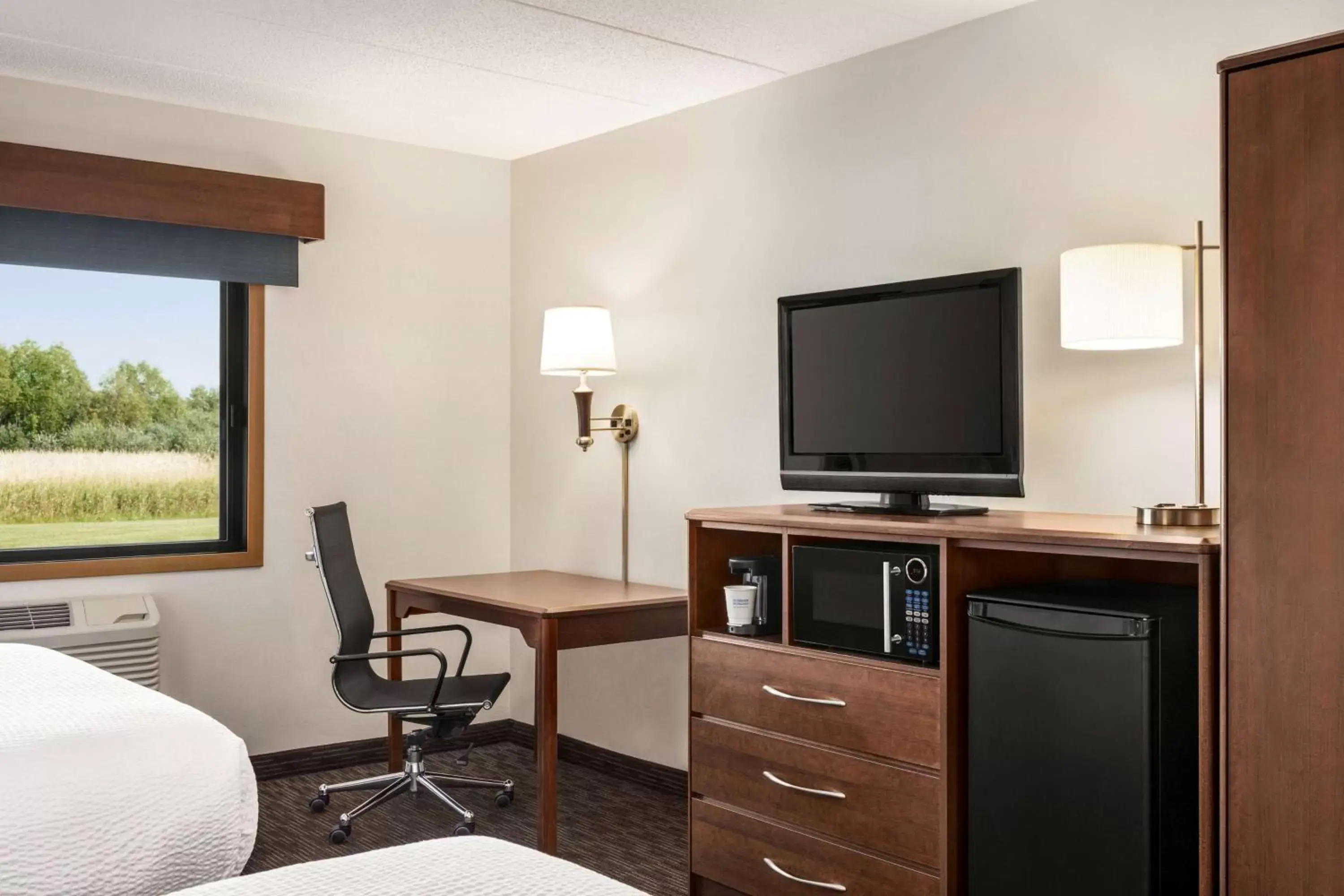 Photo of the whole room, TV/Entertainment Center in AmericInn by Wyndham Baudette