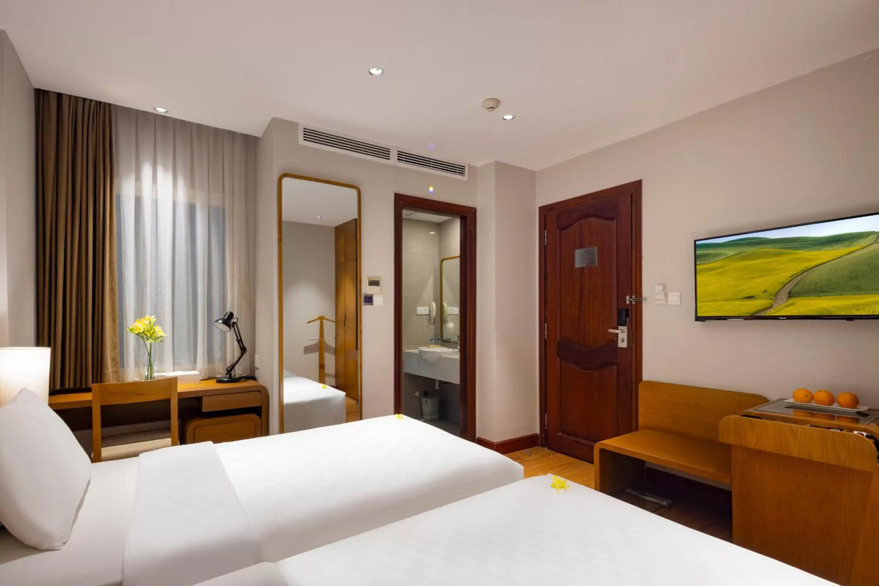 Bedroom, TV/Entertainment Center in Harmony Saigon Hotel & Spa