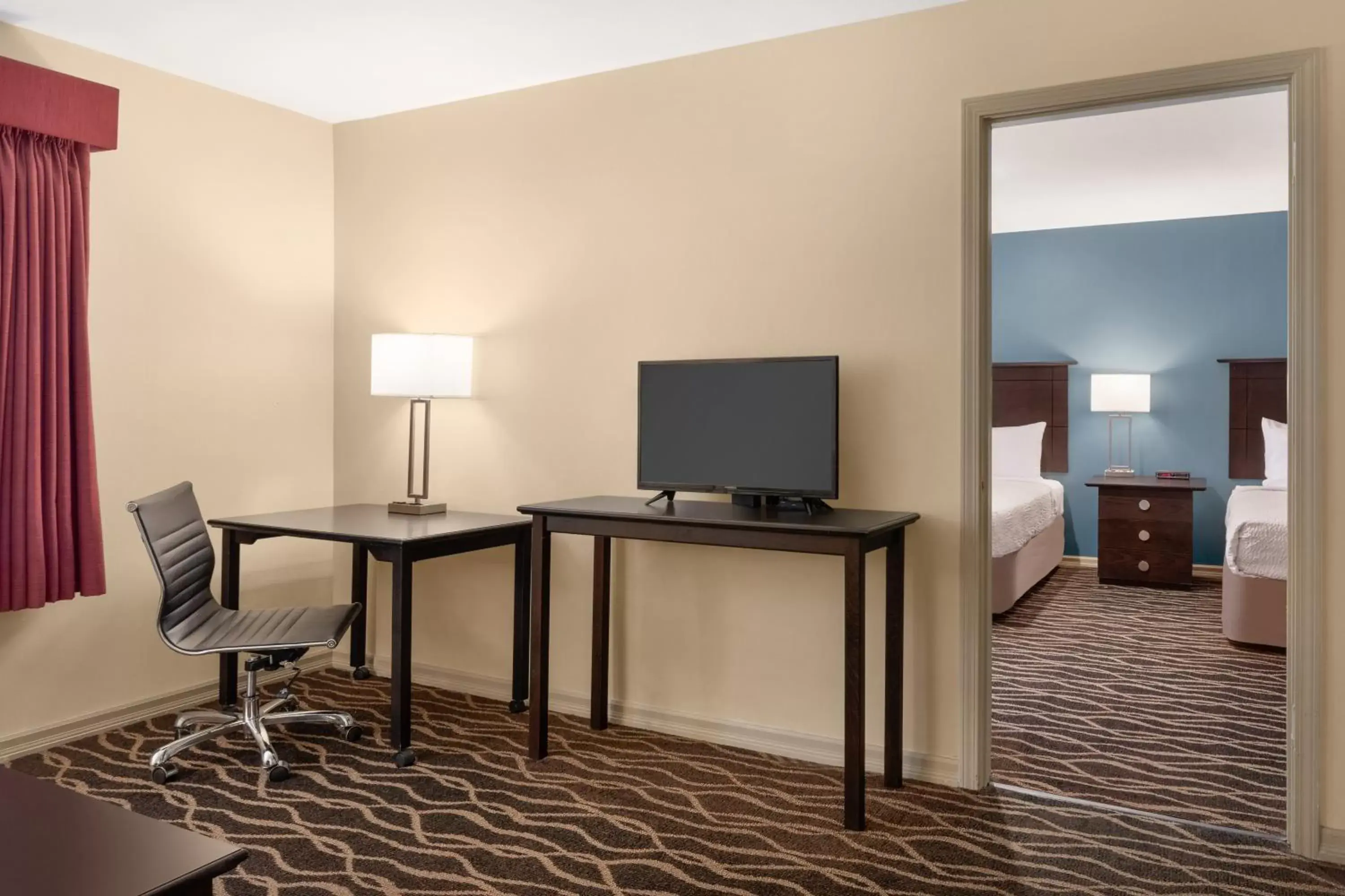 TV/Entertainment Center in Days Inn and Suites by Wyndham Sikeston