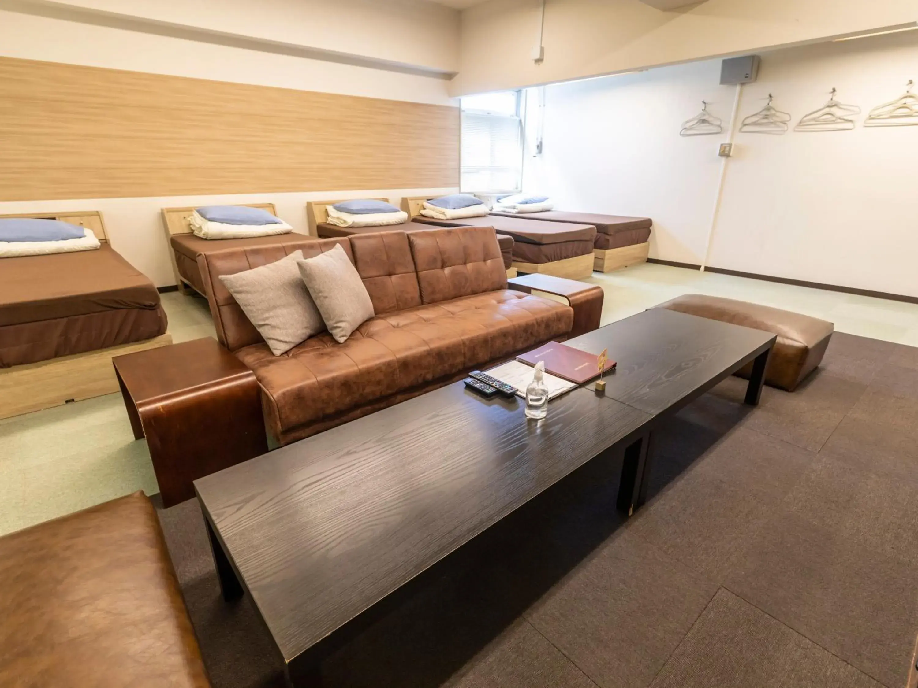 Bed, Seating Area in Omotenashi Hostel Miyajima