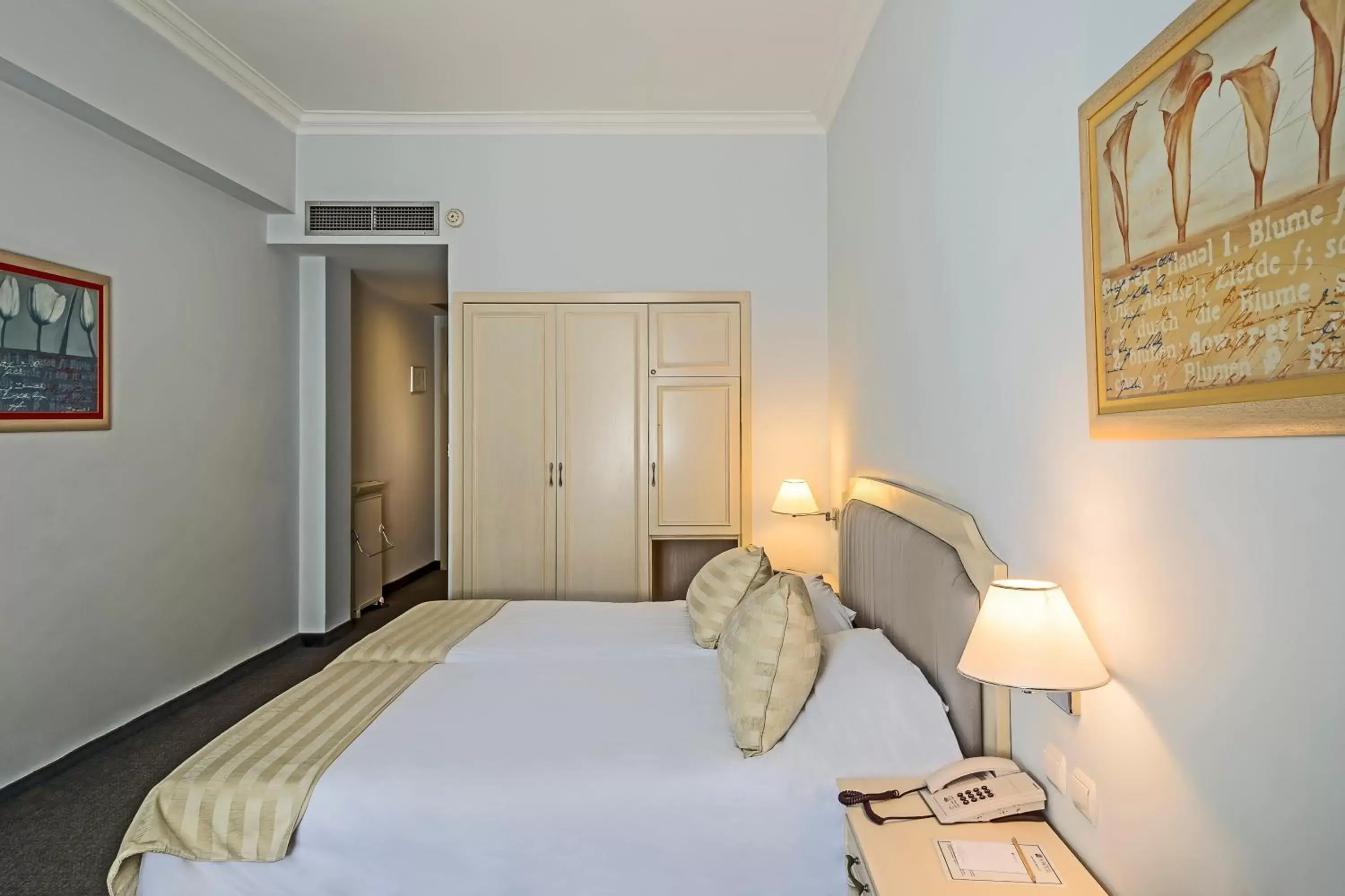 Bed in Airotel Stratos Vassilikos Hotel