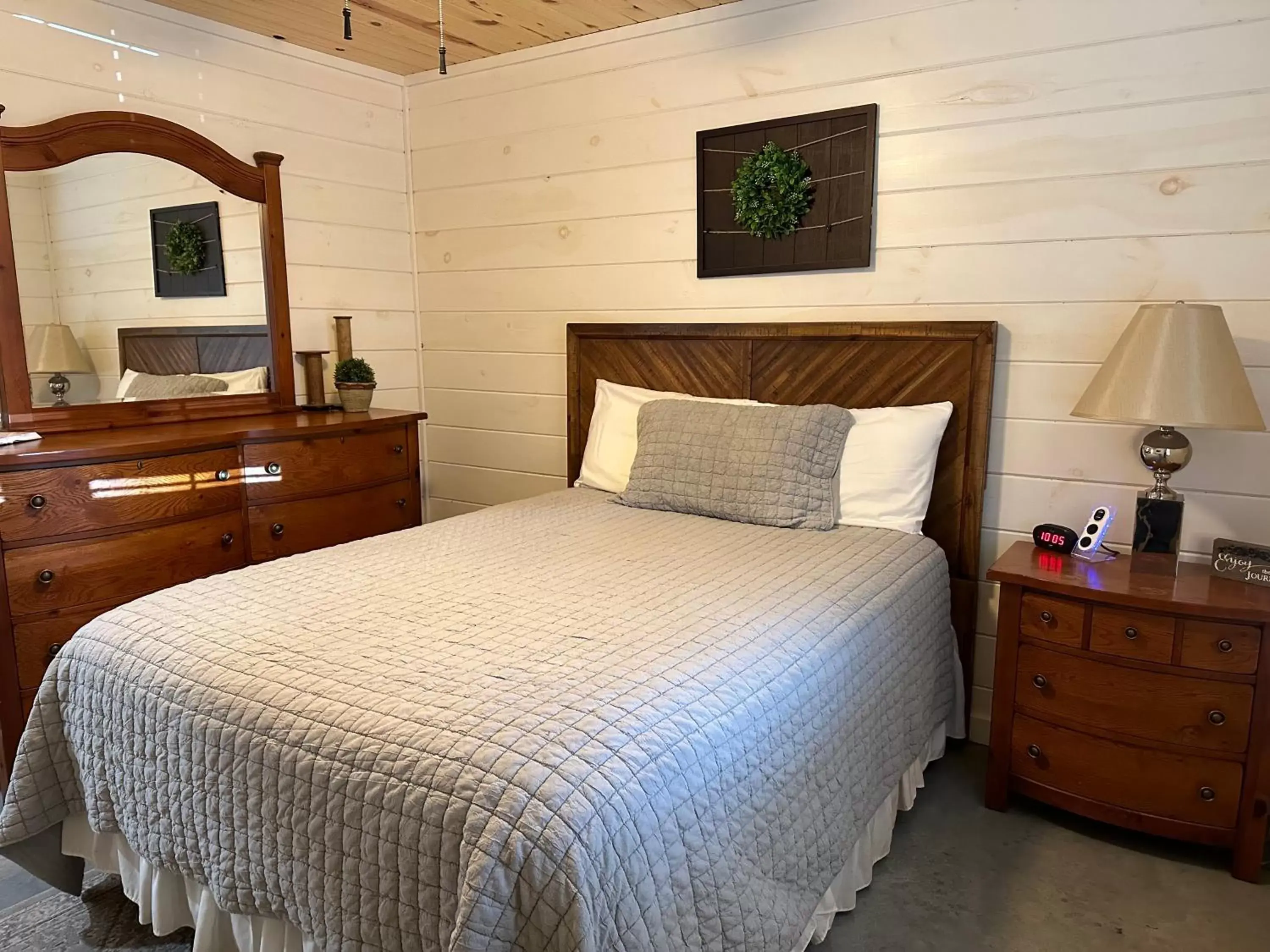 Bed in Knotty Squirrel Cabins