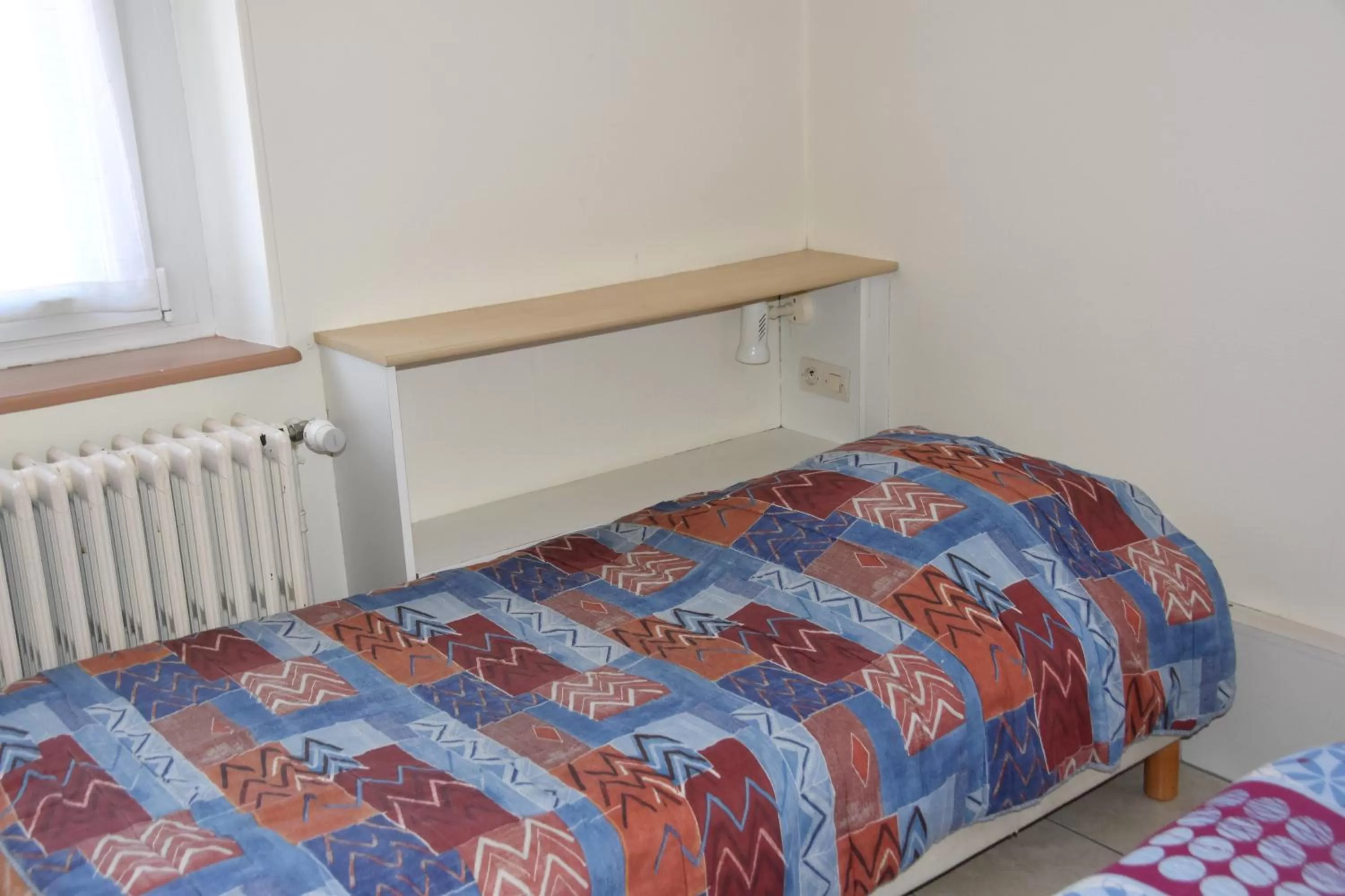 Bed in Hotel Gai Relais