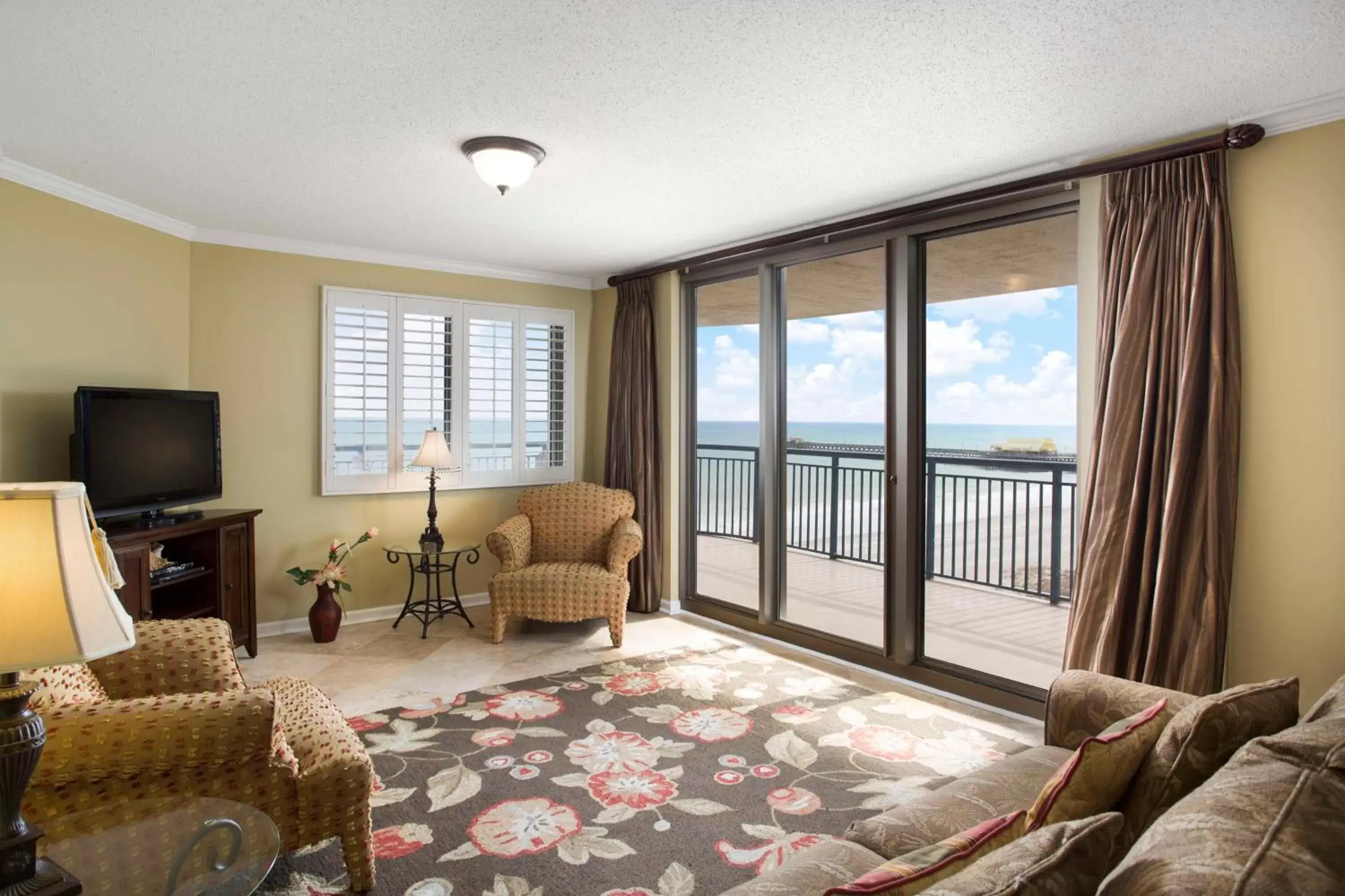 Bed, Seating Area in Kingston Plantation Condos