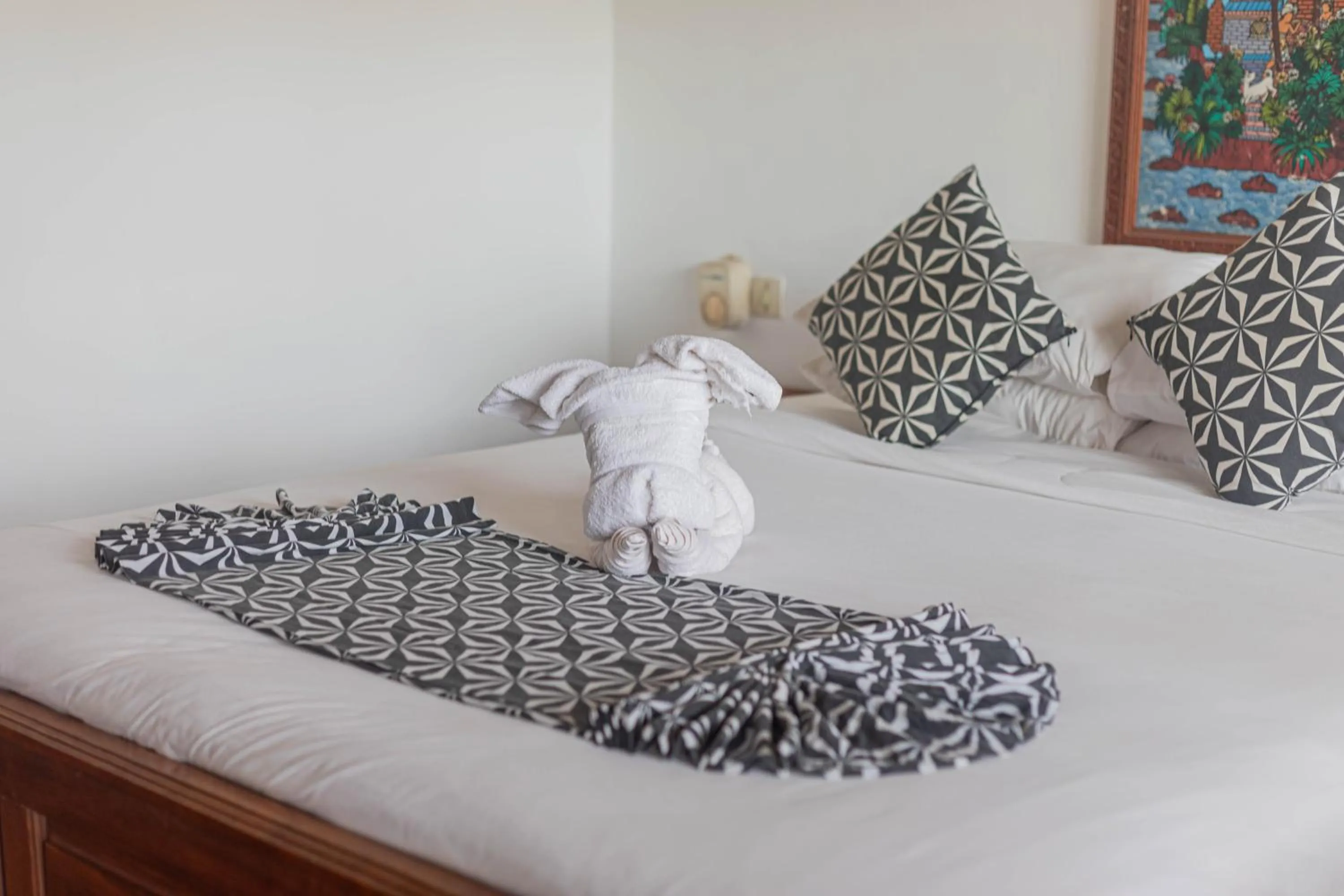 Bed in Puri Mango Guest House Sanur