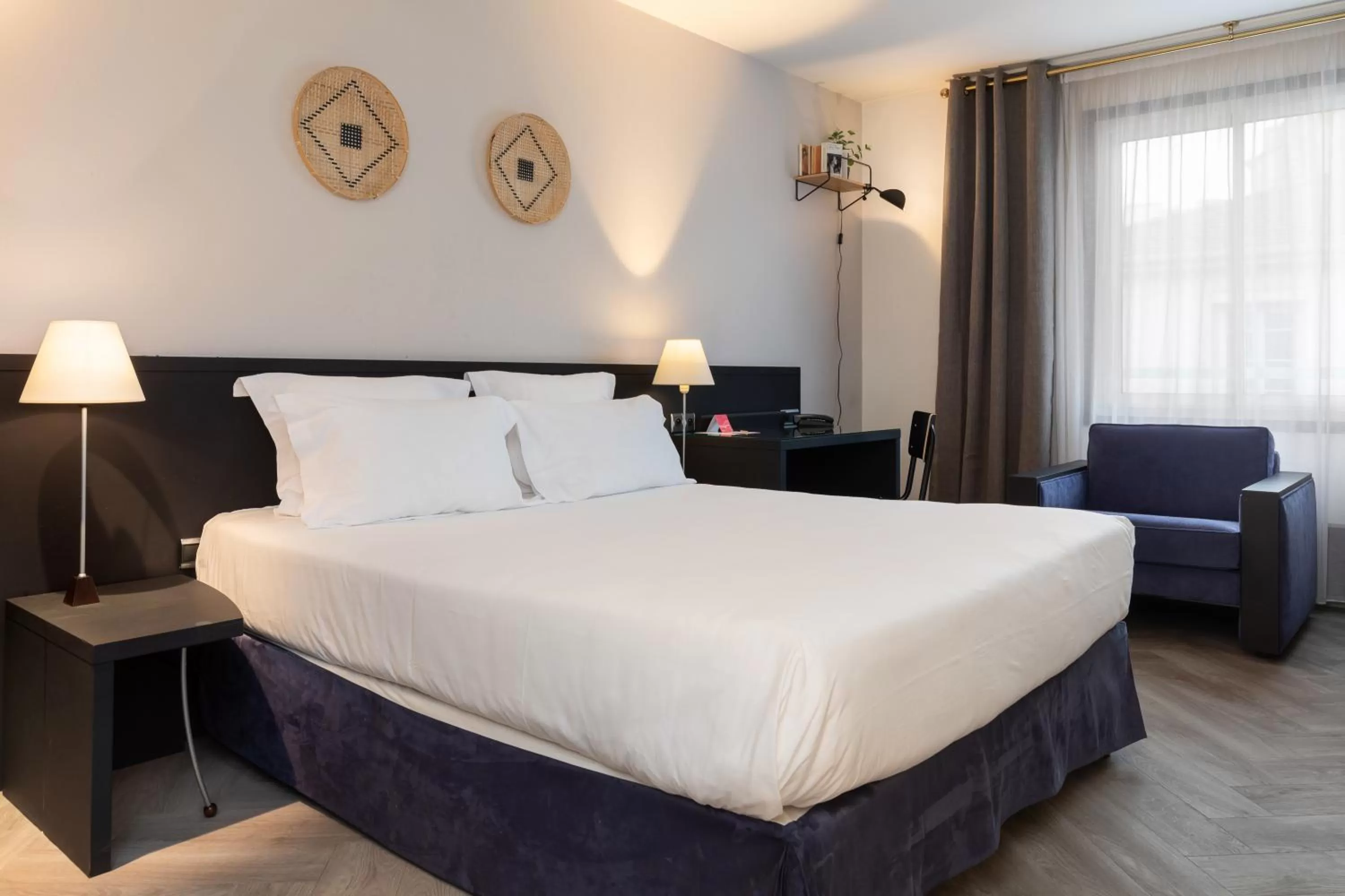 Bed in Hôtel Chromatics & Restaurant Hill Club by HappyCulture