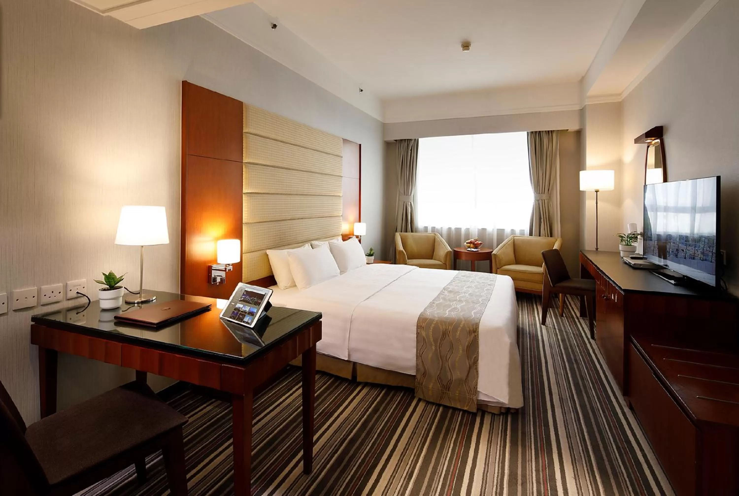 Photo of the whole room, Bed in B P International