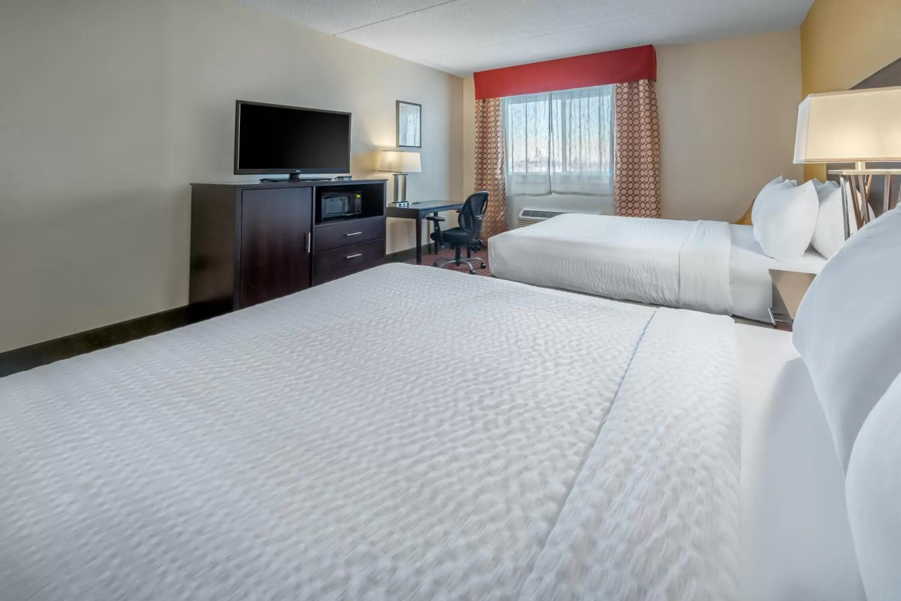 Bed in Grand Williston Hotel and Conference Center